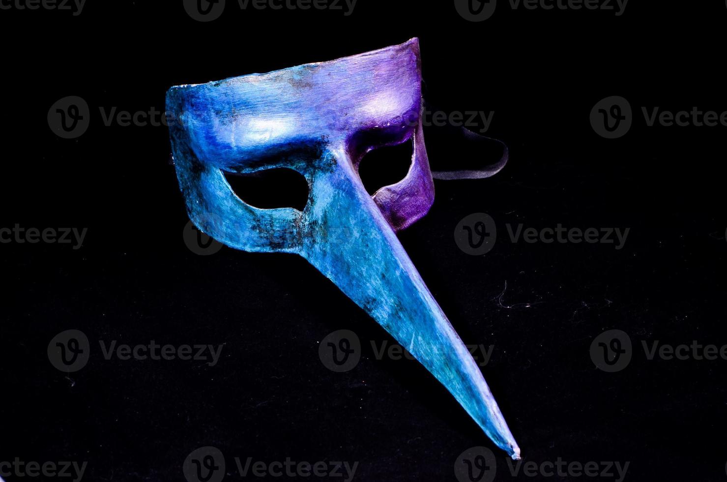 Mask on dark background photo