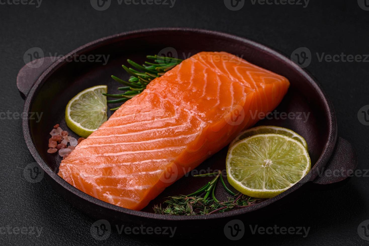 Fresh tasty raw red fish fillet with spices and herbs photo