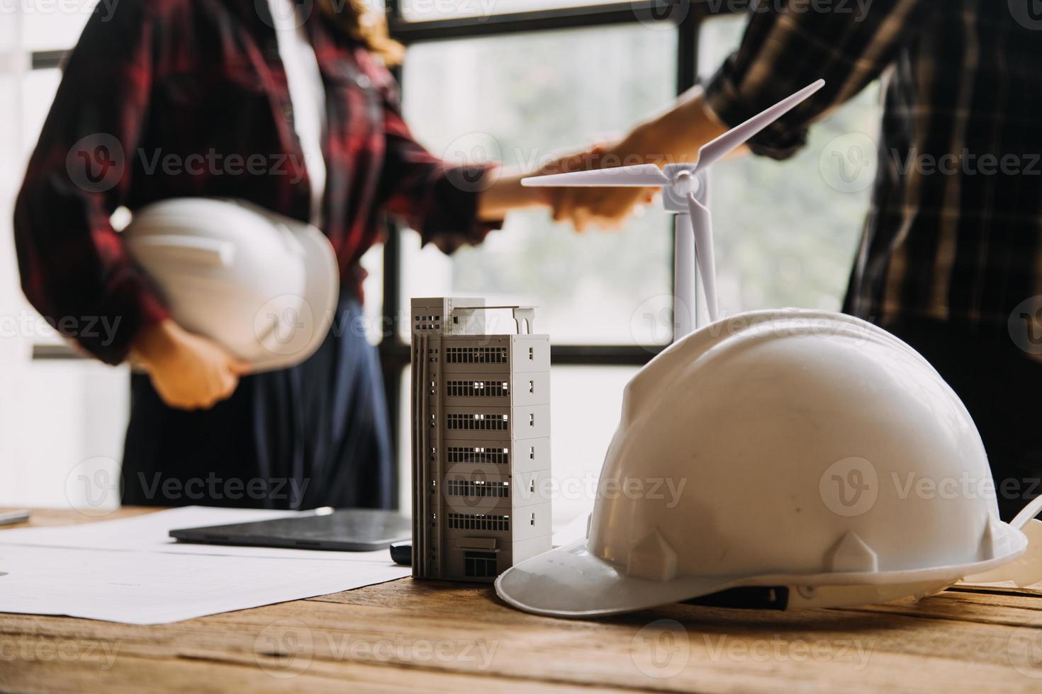 Construction and structure concept of engineer working drawing on blueprint meeting for project working with partner on model building and engineering tools in working site, construction concept photo