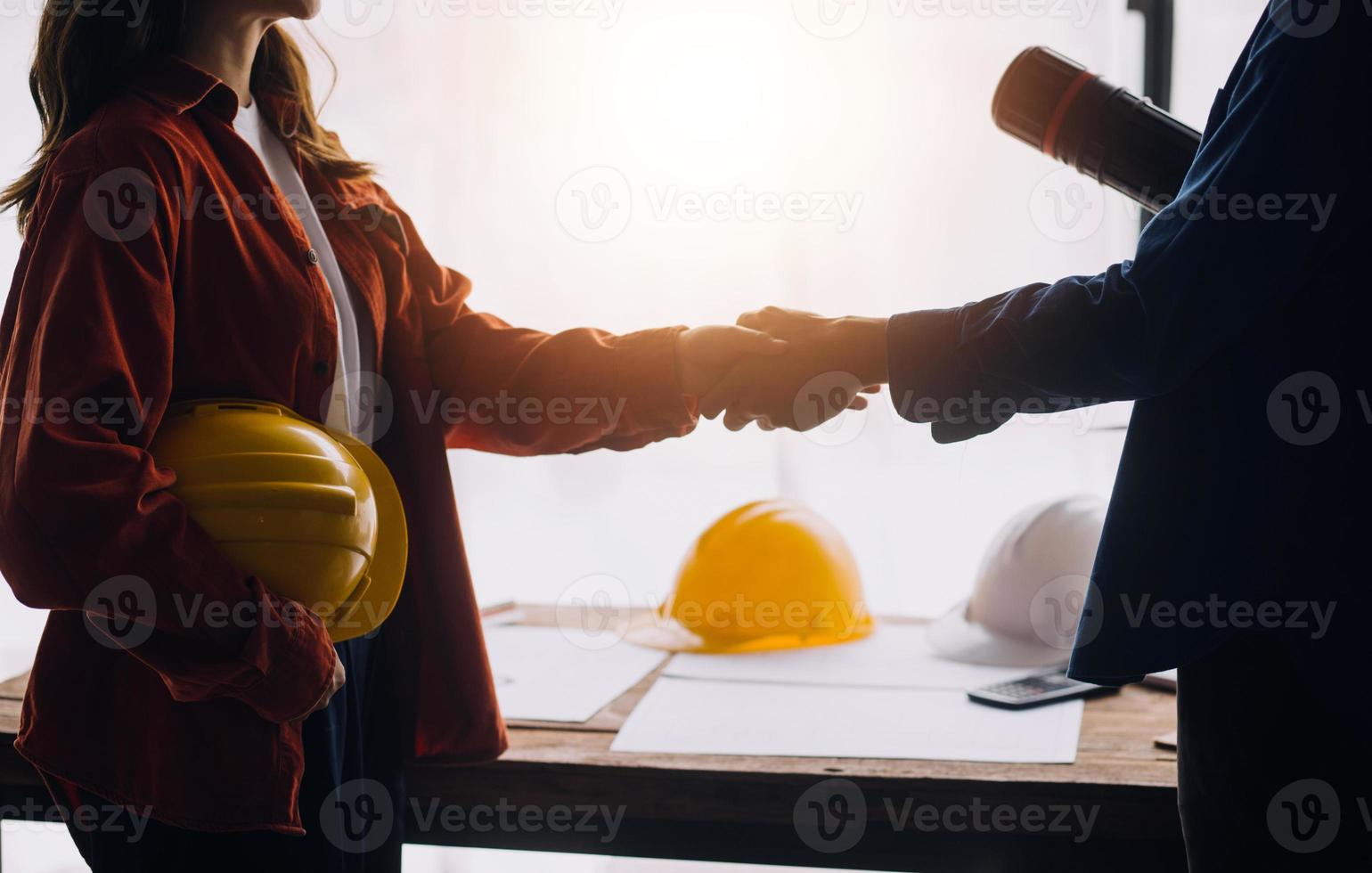 Construction and structure concept of engineer working drawing on blueprint meeting for project working with partner on model building and engineering tools in working site, construction concept photo