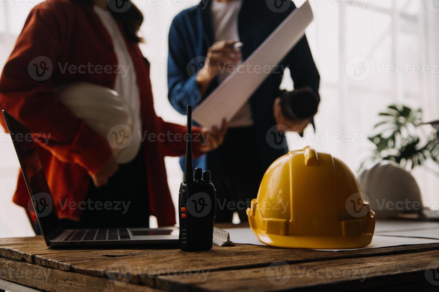 Construction and structure concept of engineer working drawing on blueprint meeting for project working with partner on model building and engineering tools in working site, construction concept photo