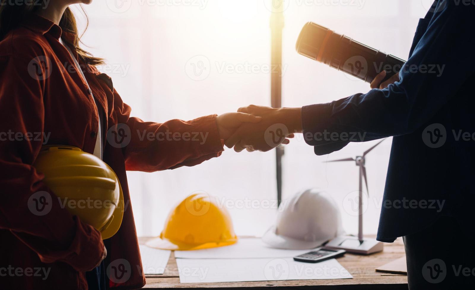 Construction and structure concept of engineer working drawing on blueprint meeting for project working with partner on model building and engineering tools in working site, construction concept photo