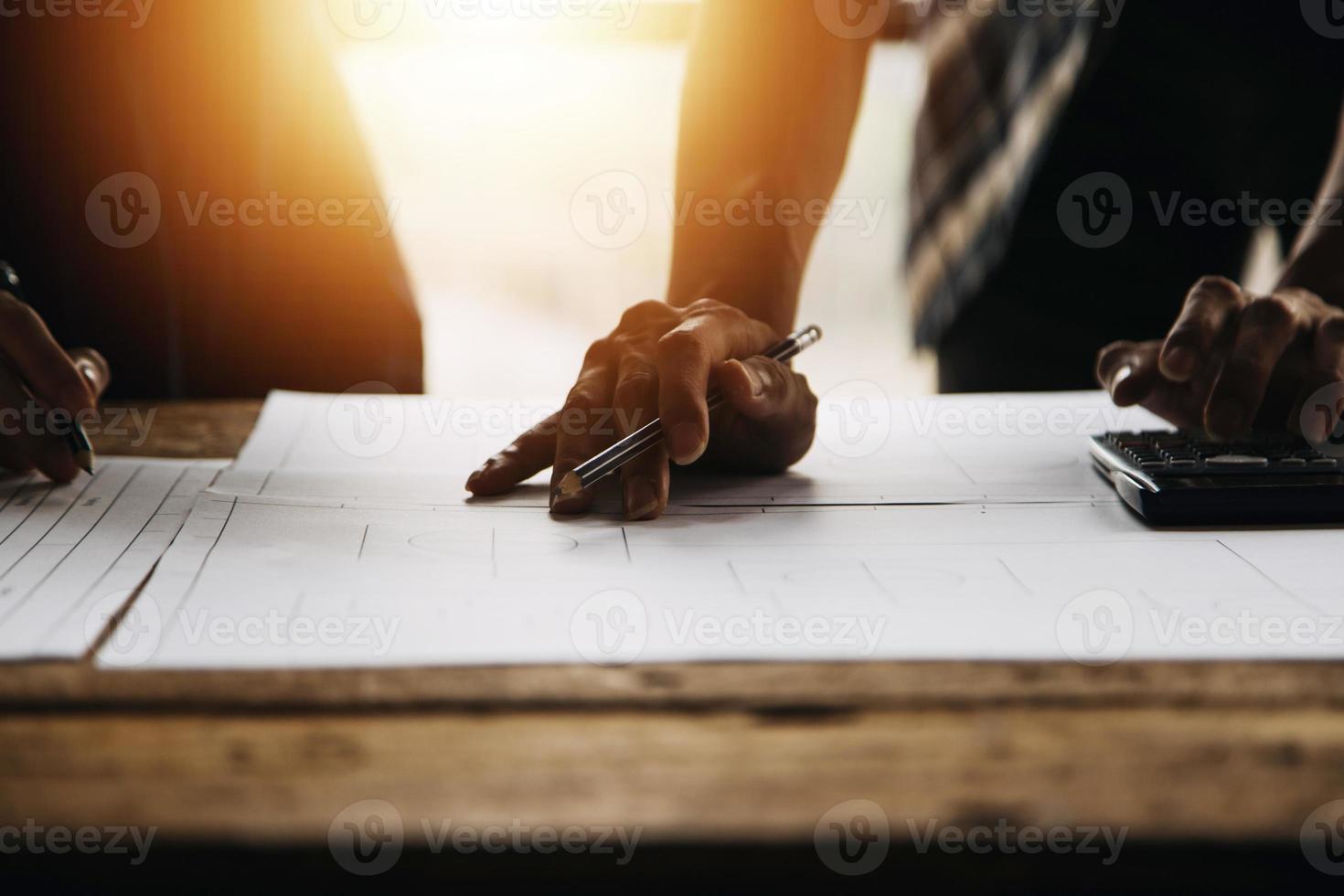 Construction and structure concept of engineer working drawing on blueprint meeting for project working with partner on model building and engineering tools in working site, construction concept photo
