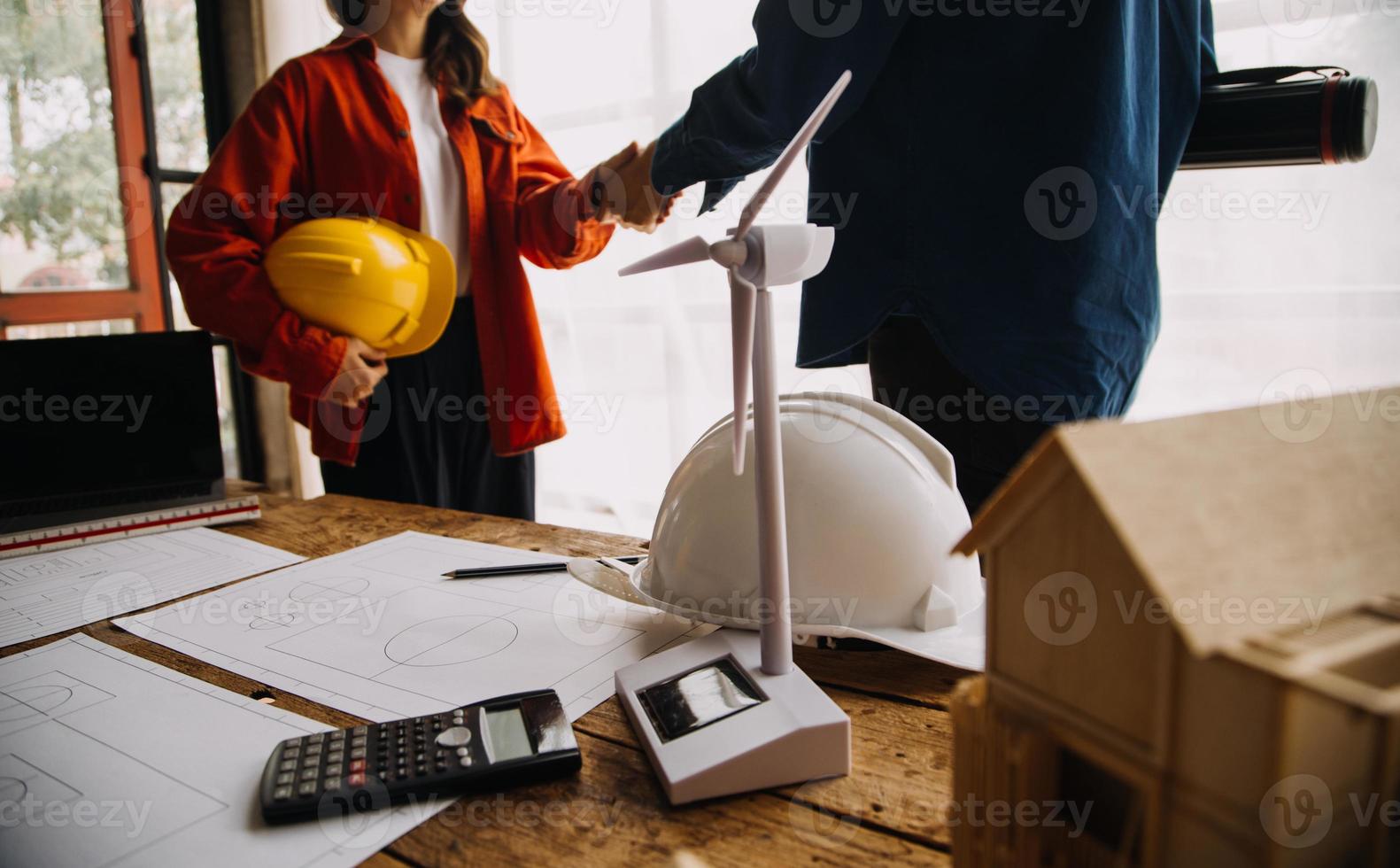Construction and structure concept of engineer working drawing on blueprint meeting for project working with partner on model building and engineering tools in working site, construction concept photo