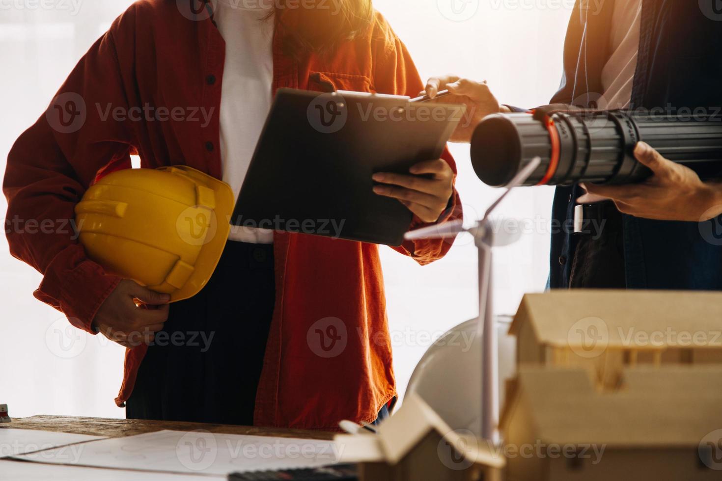 Construction and structure concept of engineer working drawing on blueprint meeting for project working with partner on model building and engineering tools in working site, construction concept photo