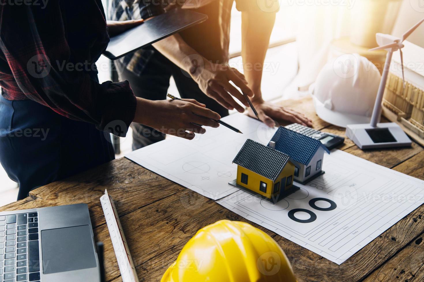 Construction and structure concept of engineer working drawing on blueprint meeting for project working with partner on model building and engineering tools in working site, construction concept photo