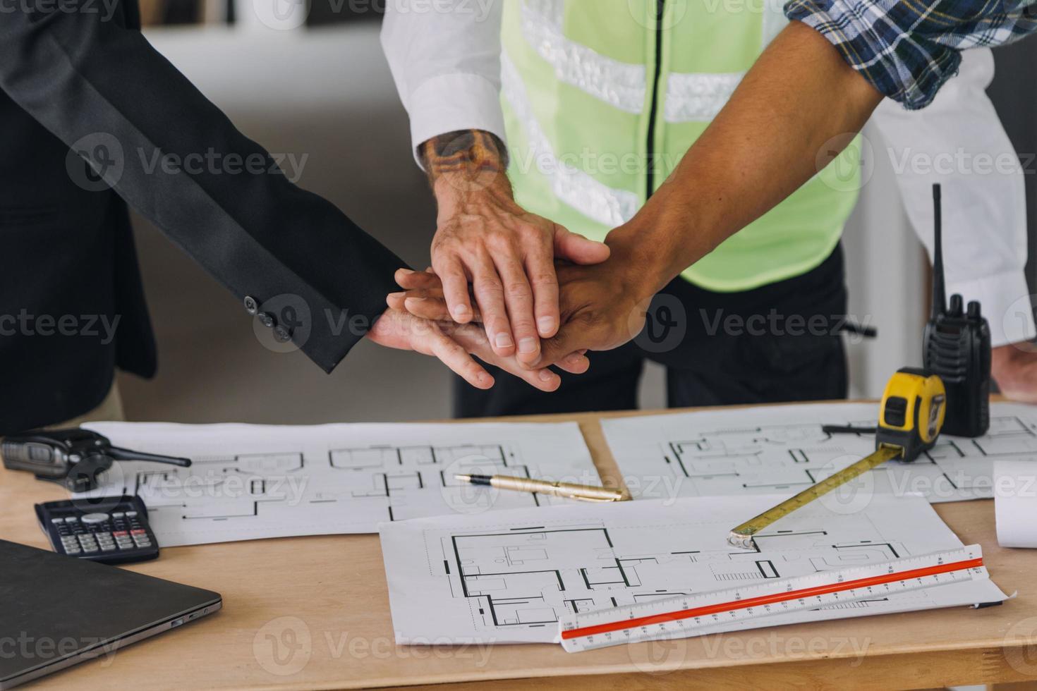 Diverse Team of Specialists Use Tablet Computer on Construction Site. Real Estate Building Project with Civil Engineer, Architect, Business Investor and General Worker Discussing Plan Details. photo