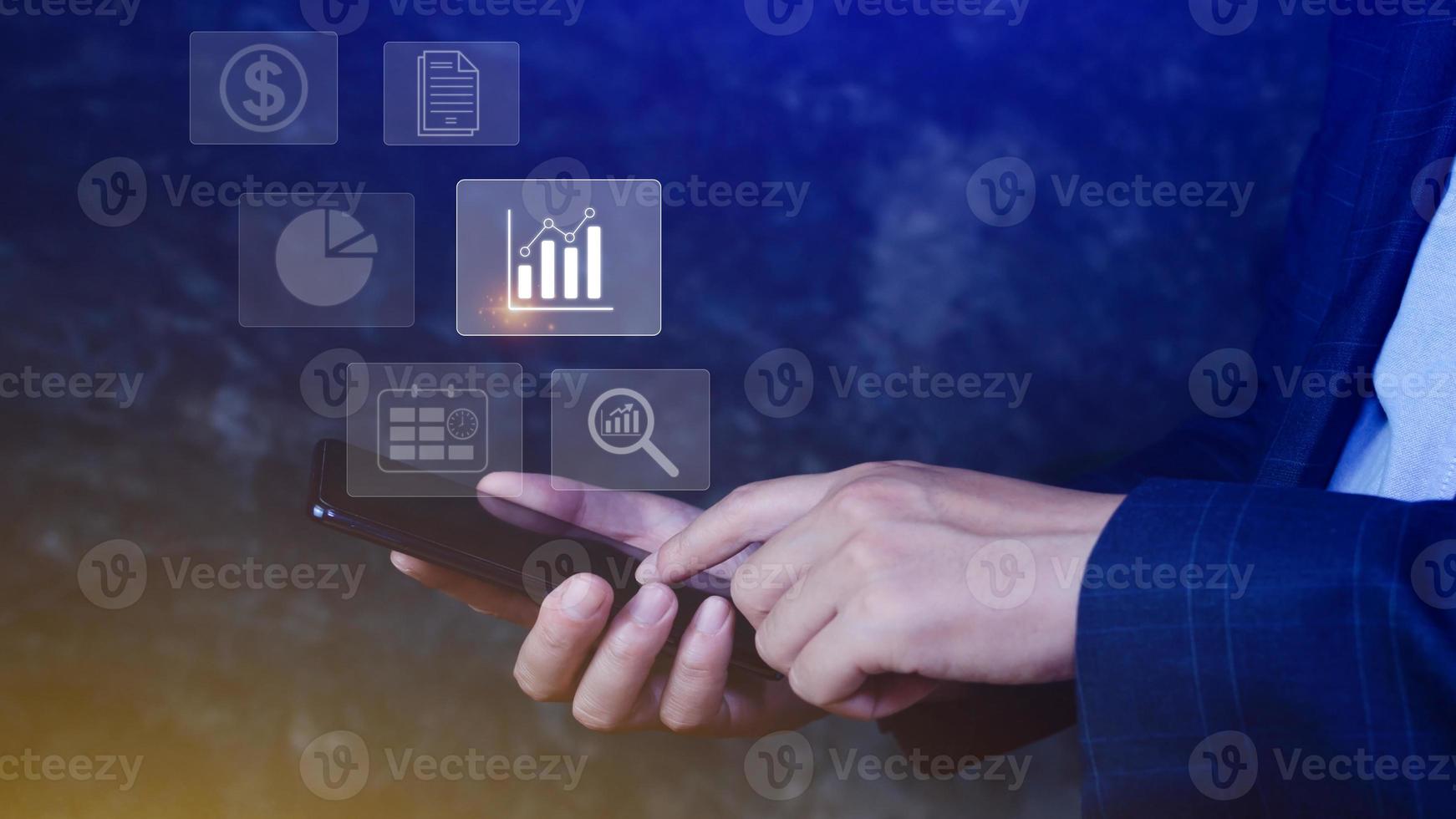 Data analytics and business intelligence BI concept with chart and graph icons on digital screen interface on smartphone and business people in the background. photo