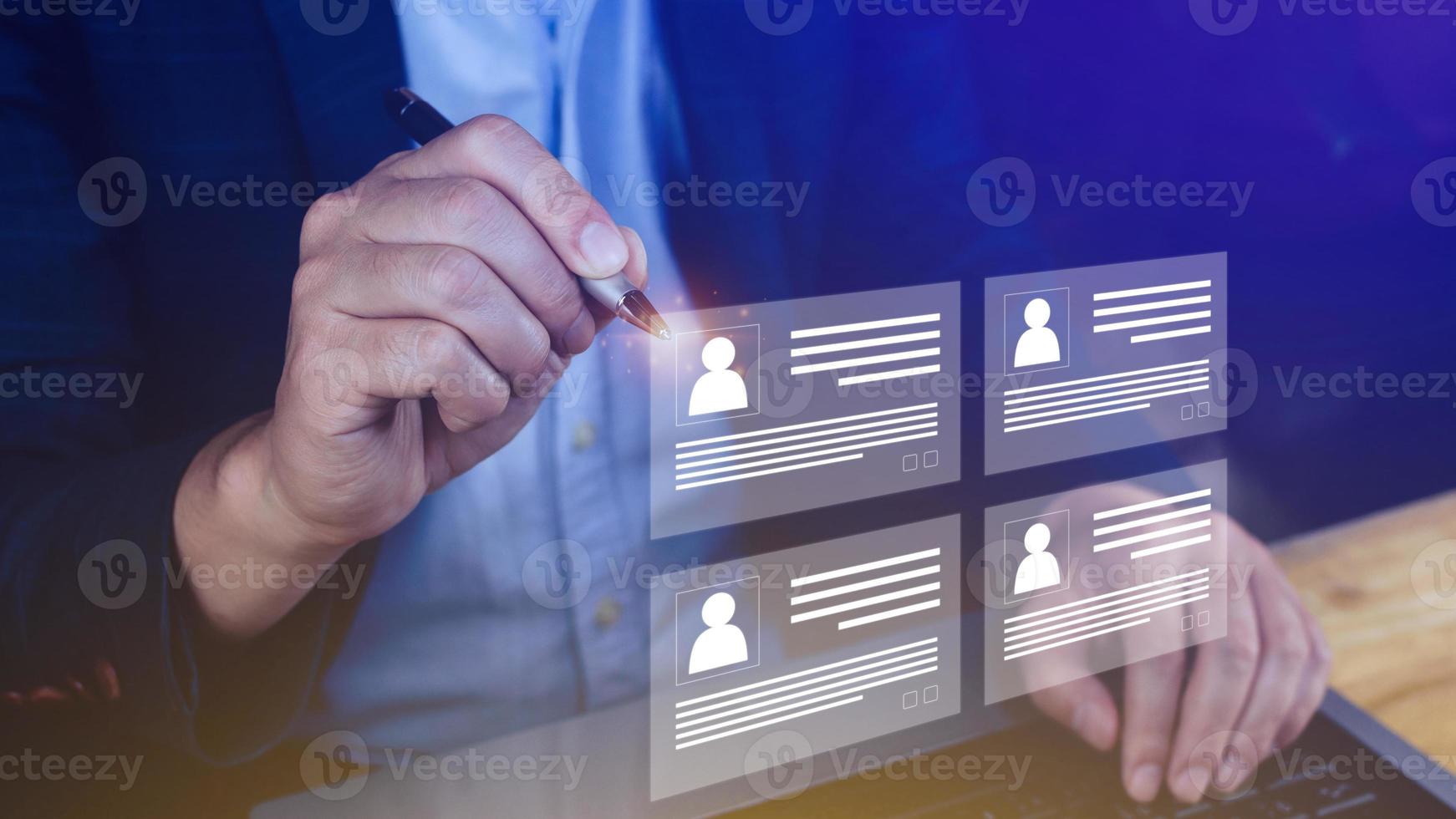 Human resources manager choosing professional profile to hire on virtual screen interface, recruitment concept. Businessman hand pointing icon resource HR management concept photo
