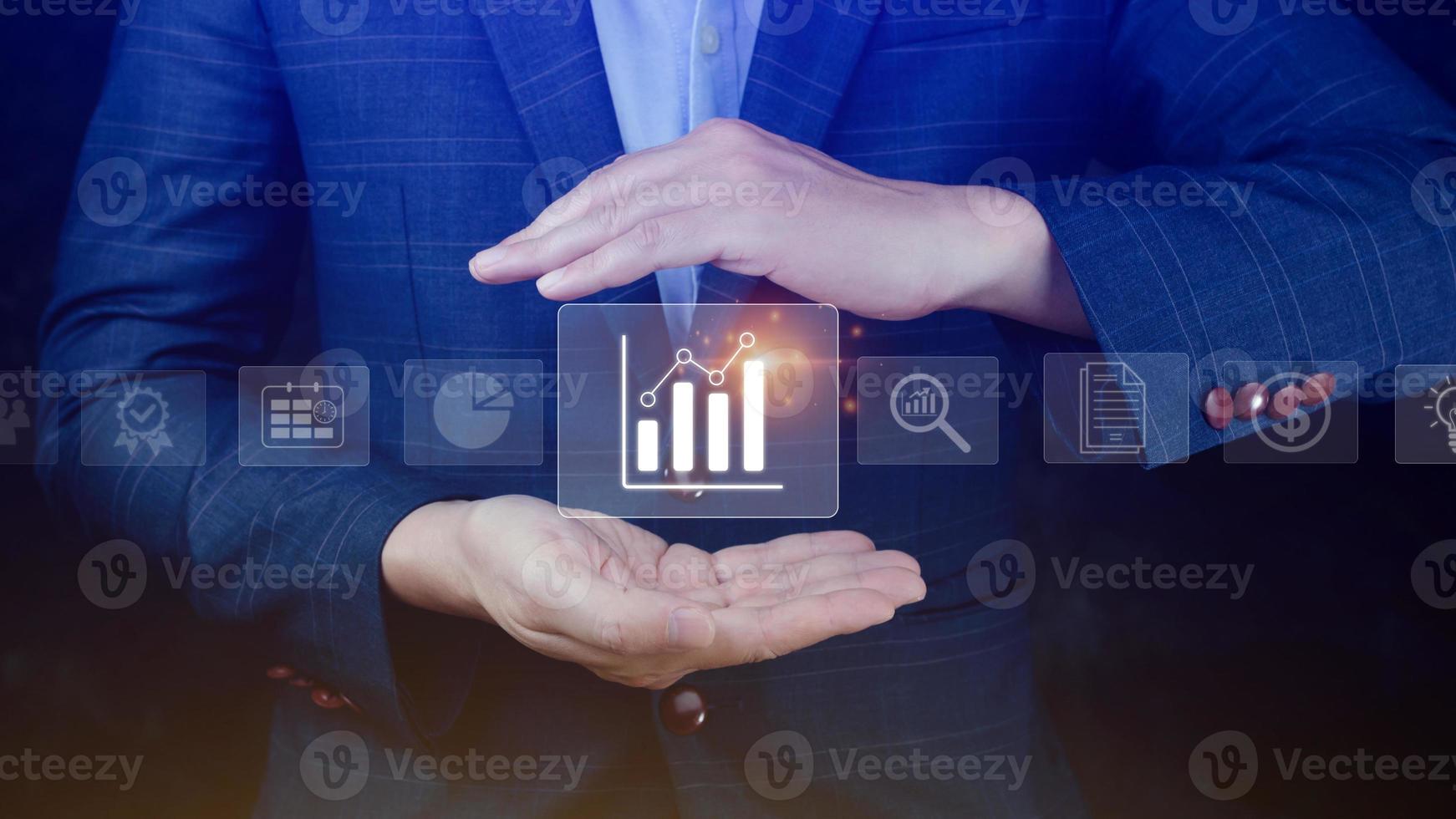 Big data analytics and business intelligence BI concept with chart and graph icons on digital screen interface and business people in the background. photo