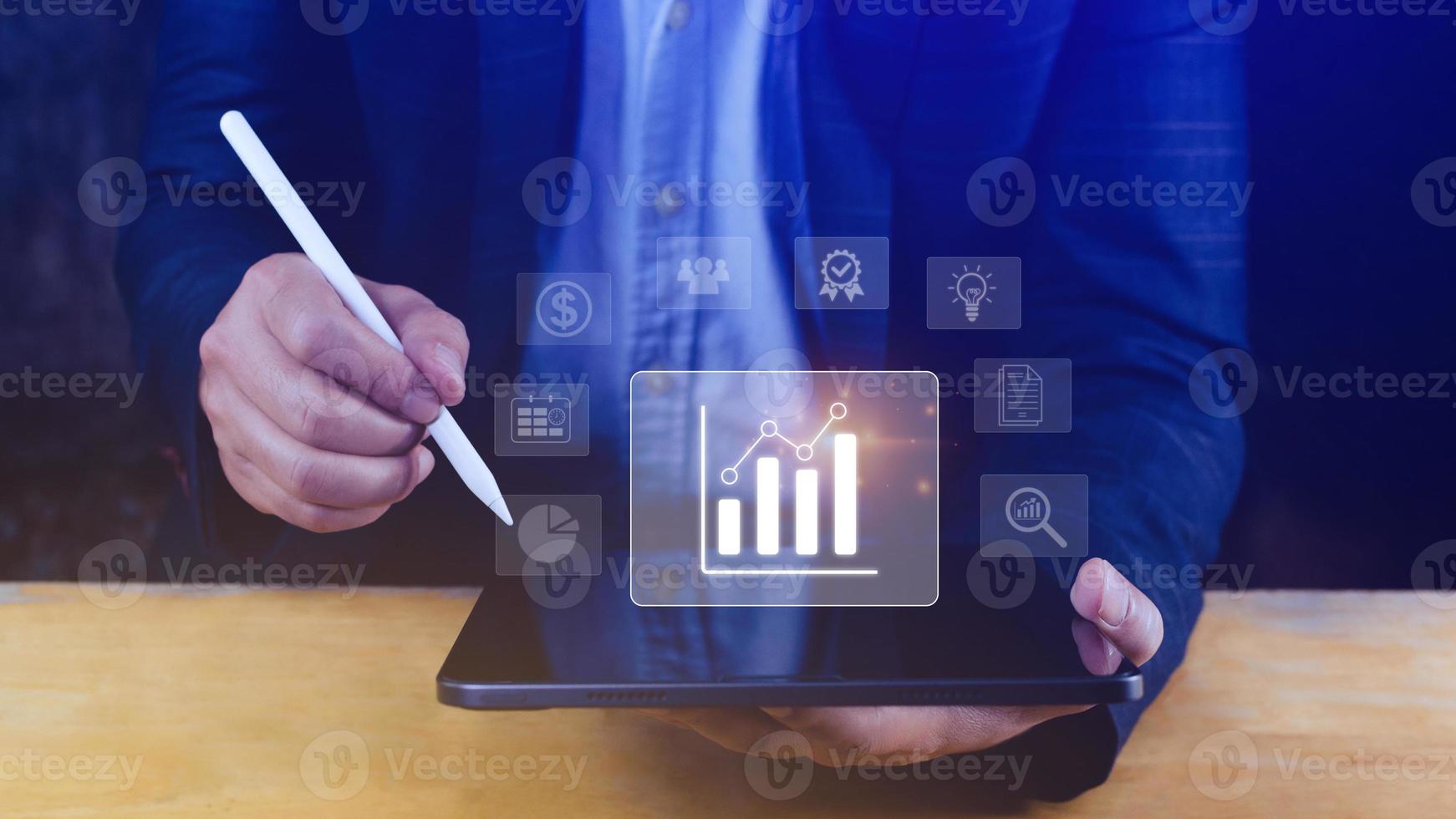 Big data analytics and business intelligence BI concept with chart and graph icons on digital screen interface and business people in the background. photo