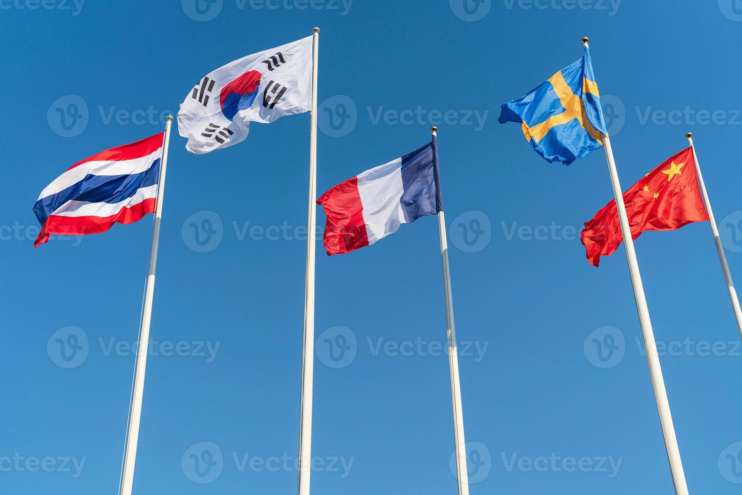 The national flags of five nations, Thailand, South Korea, France, Sweden, China photo