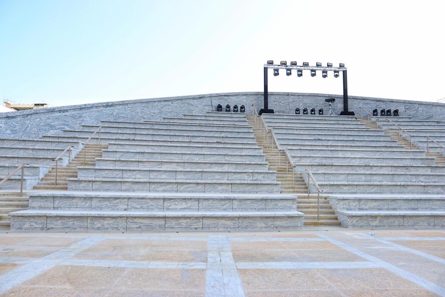 Empty stadium stairs and lights ,concrete steps outdoor photo