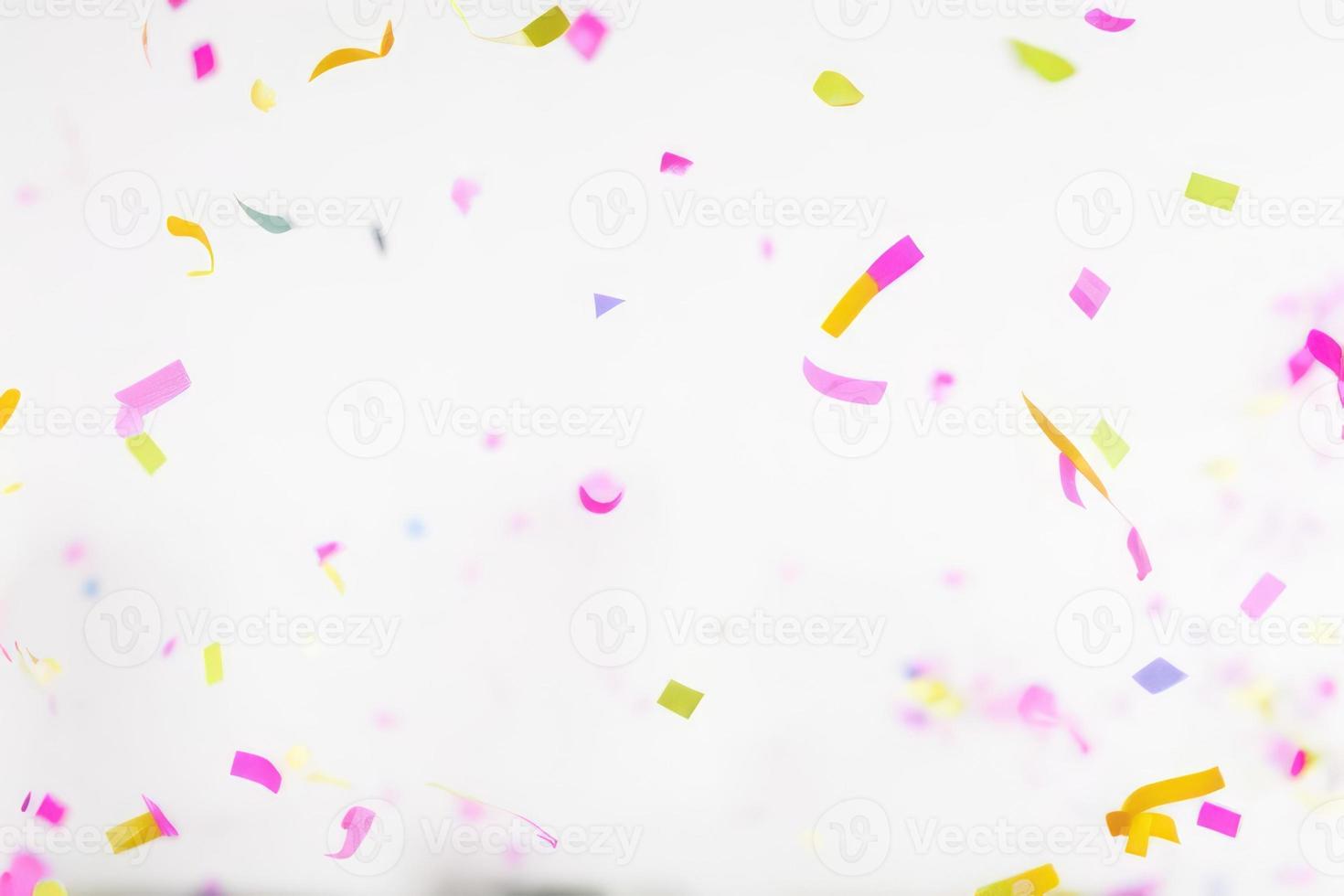 Falling shiny confetti glitters in colors. New year, birthday, valentines day design element. photo