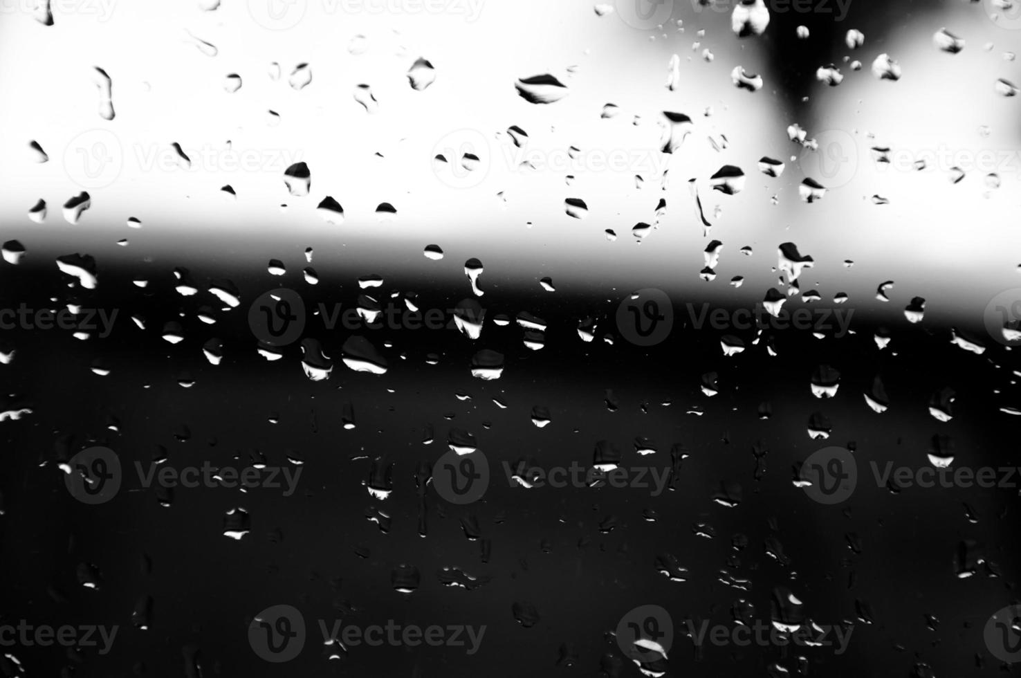 Water drops on glass texture abstract black dark background,Selective focus photo