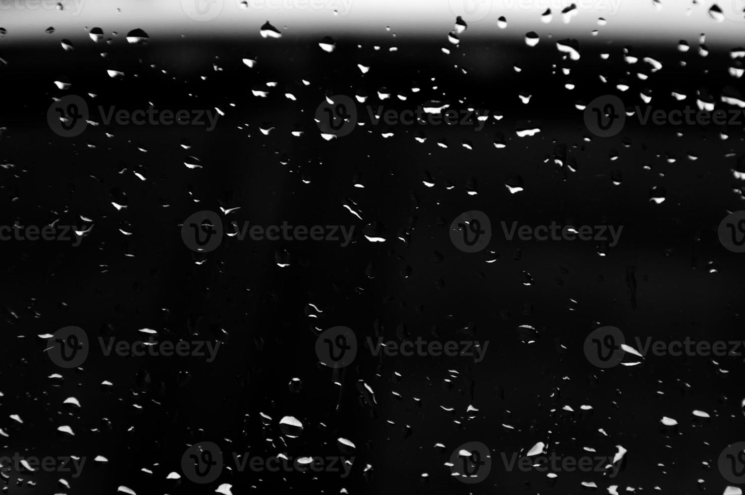 Water drops on glass texture abstract black dark background,Selective focus photo