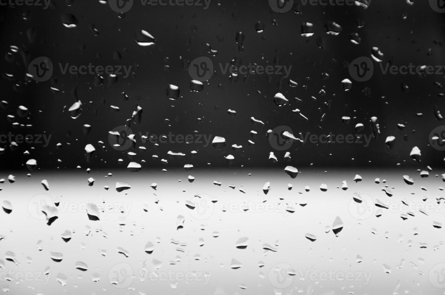 Water drops on glass texture abstract black dark background,Selective focus photo