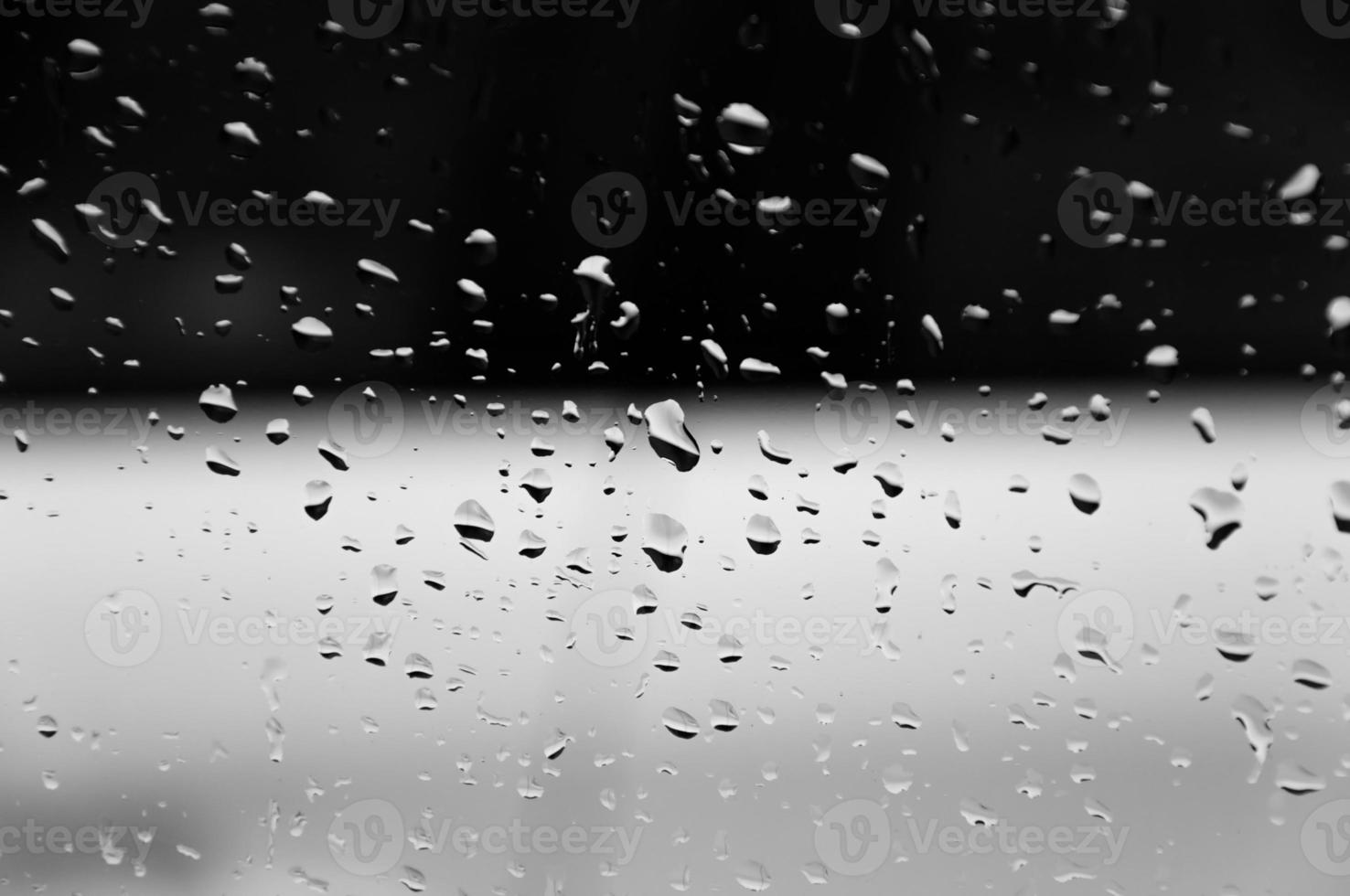 Water drops on glass texture abstract black dark background,Selective focus photo