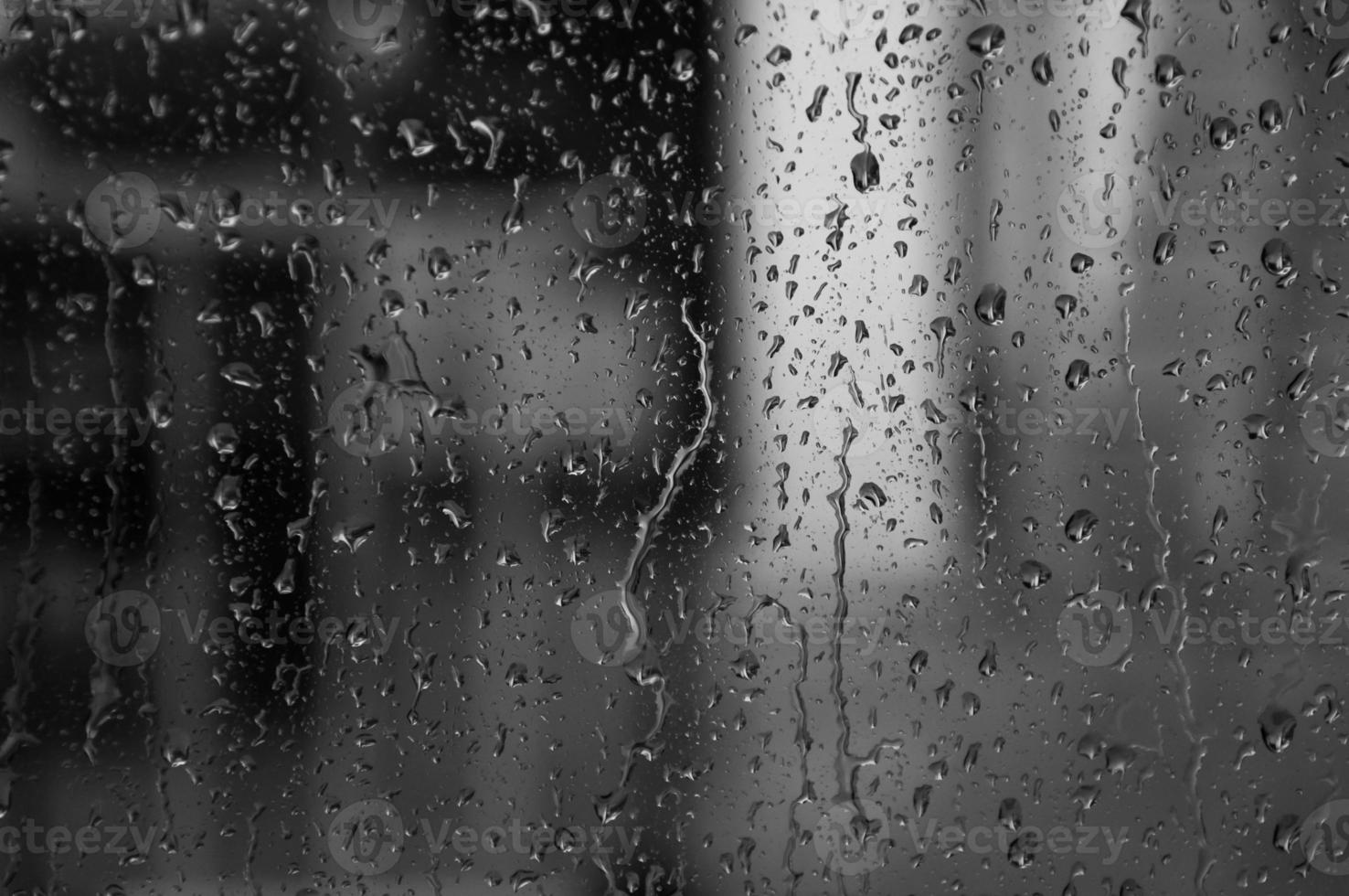 Water drops on glass texture abstract black dark background,Selective focus photo