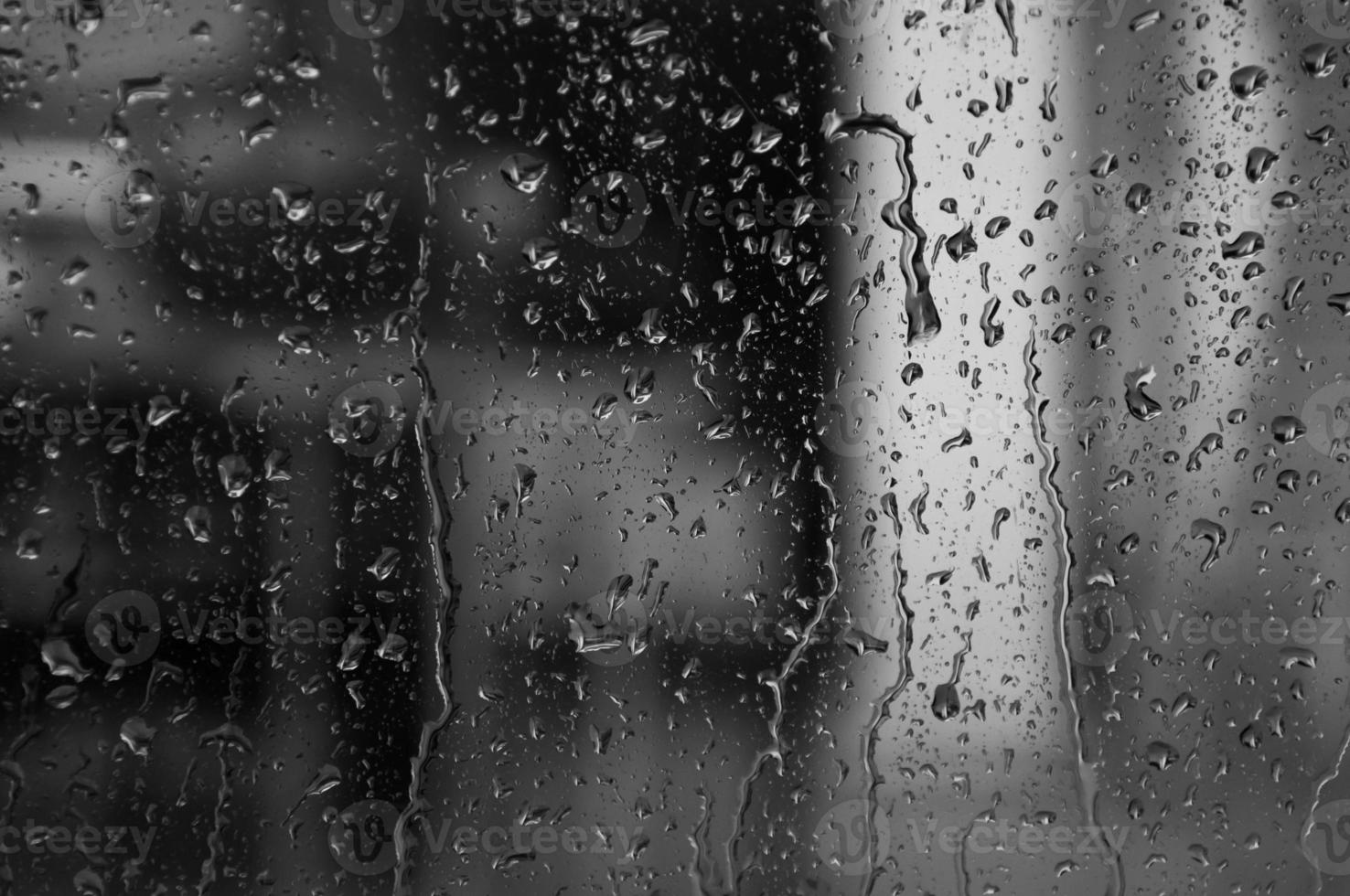 Water drops on glass texture abstract black dark background,Selective focus photo