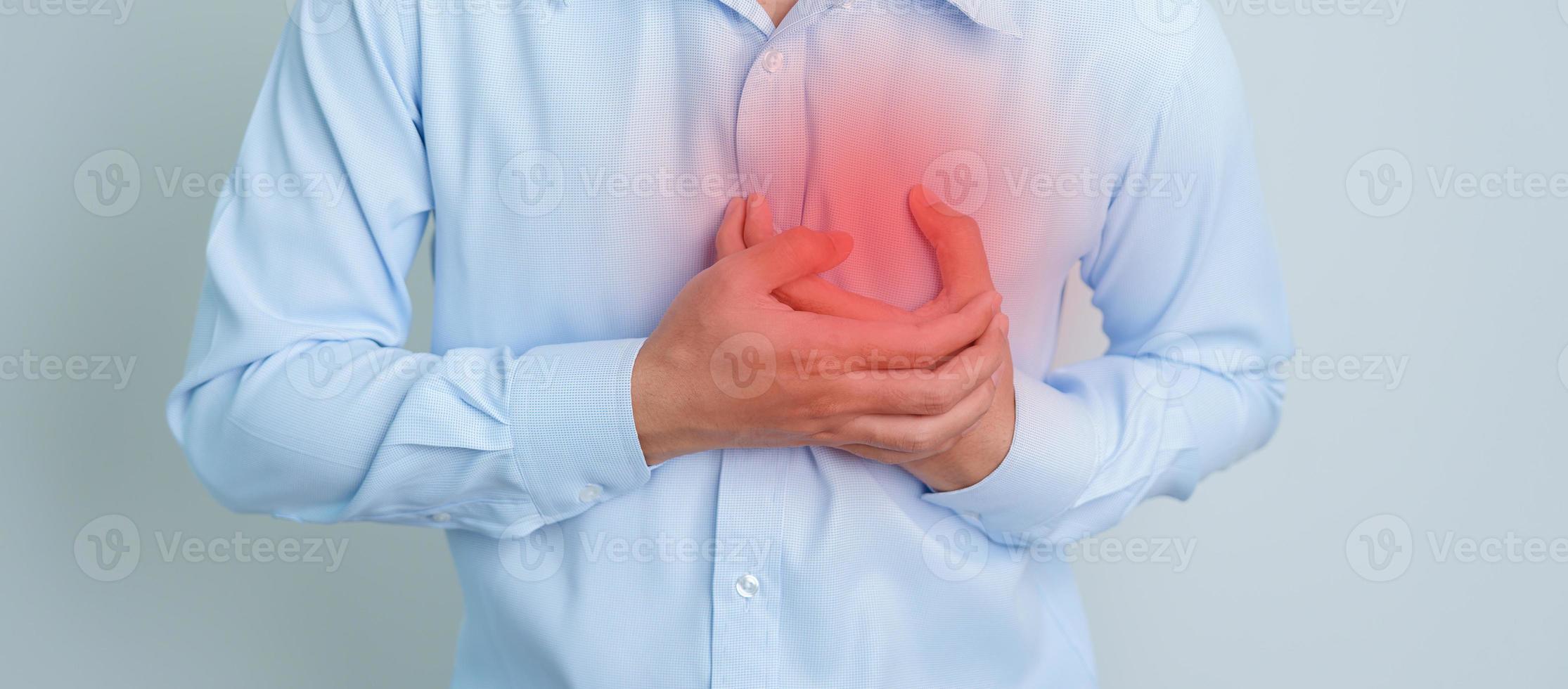 man hand holding chest ache. Heart disease, angina disease and symptom heart attack disease Cardiovascular, Atherosclerosis, Hypertensive world Heart day and health concept photo