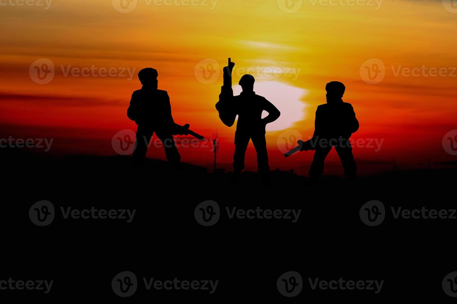 Silhouette Soldiers  with sunset and copy space add text photo