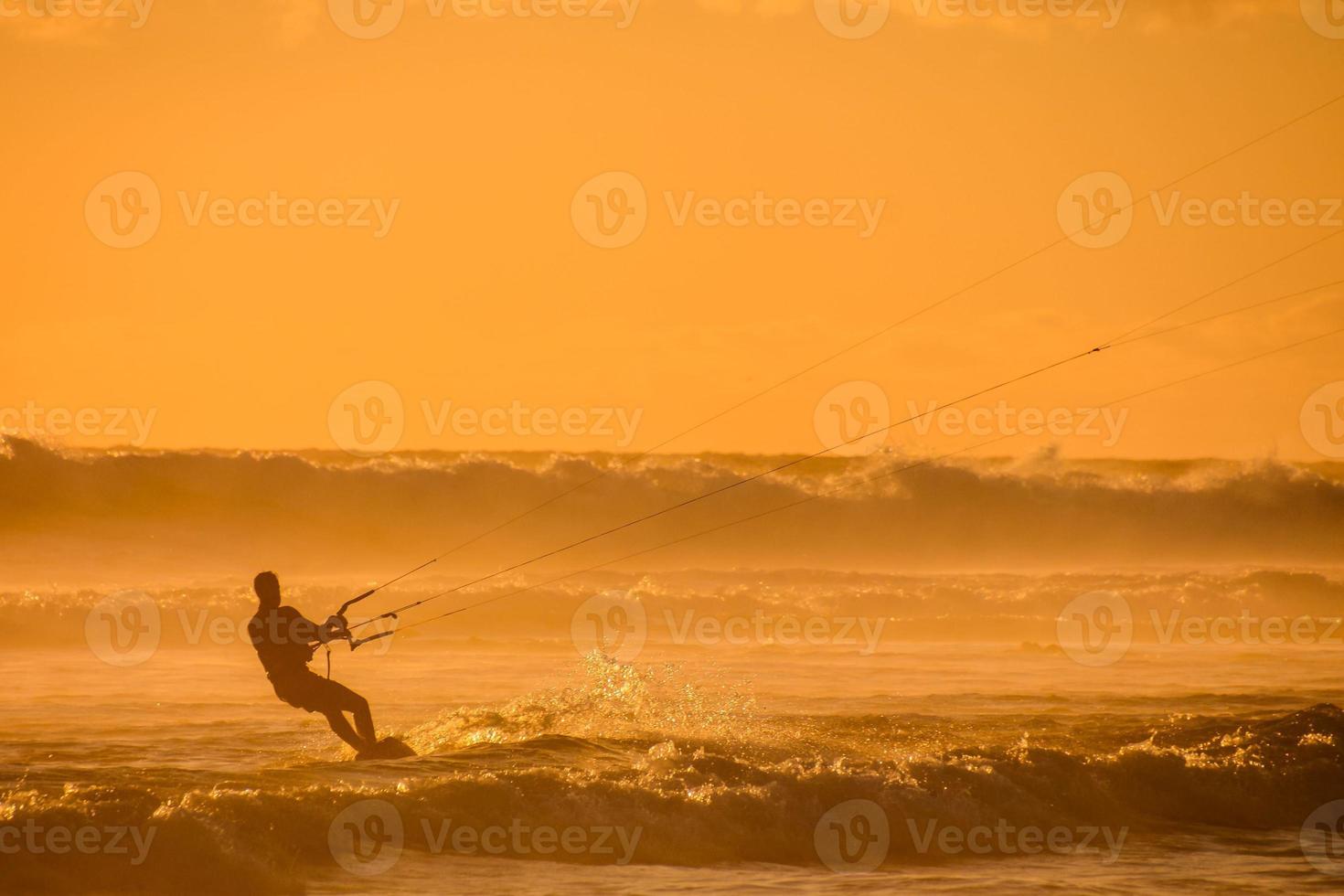 Kitesurfer at sunset photo