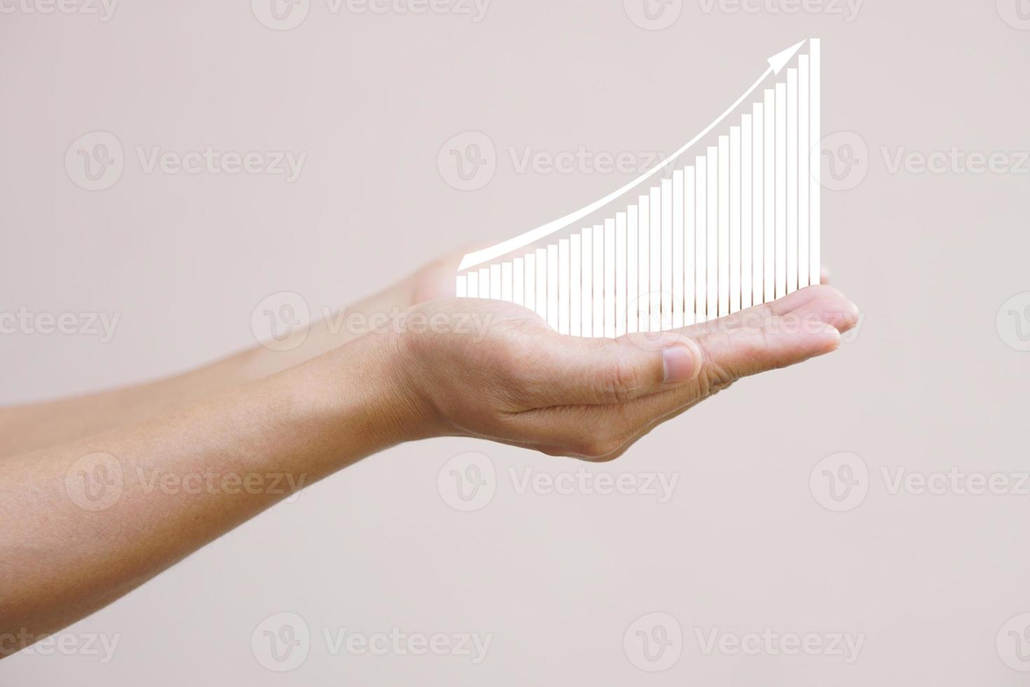 earnings graph in human hand photo