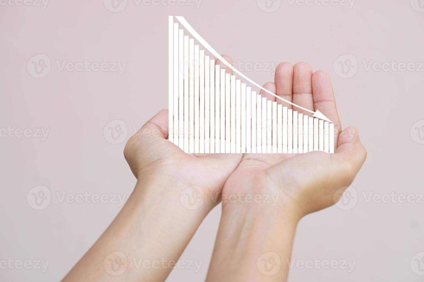 earnings graph in human hand photo