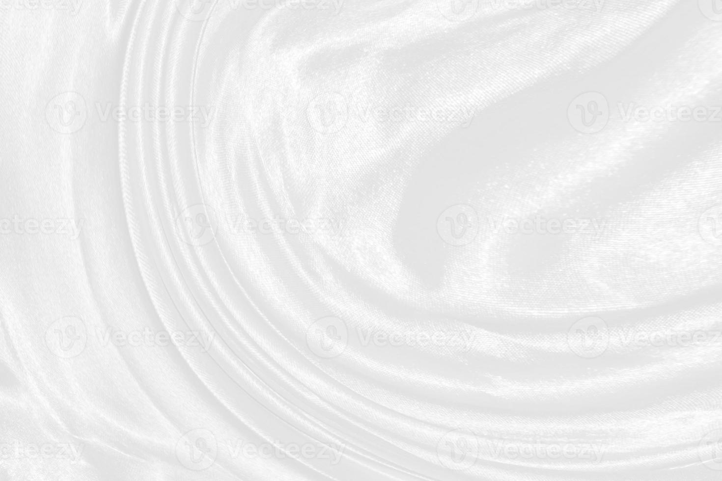 white silk textured cloth background,Closeup of rippled satin fabric with soft waves. photo
