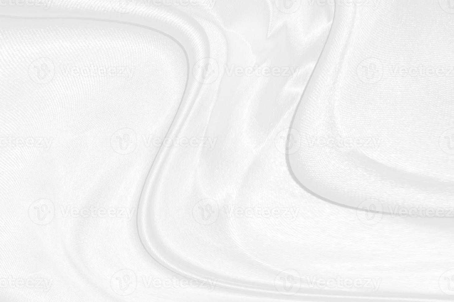 white silk textured cloth background,Closeup of rippled satin fabric with soft waves. photo