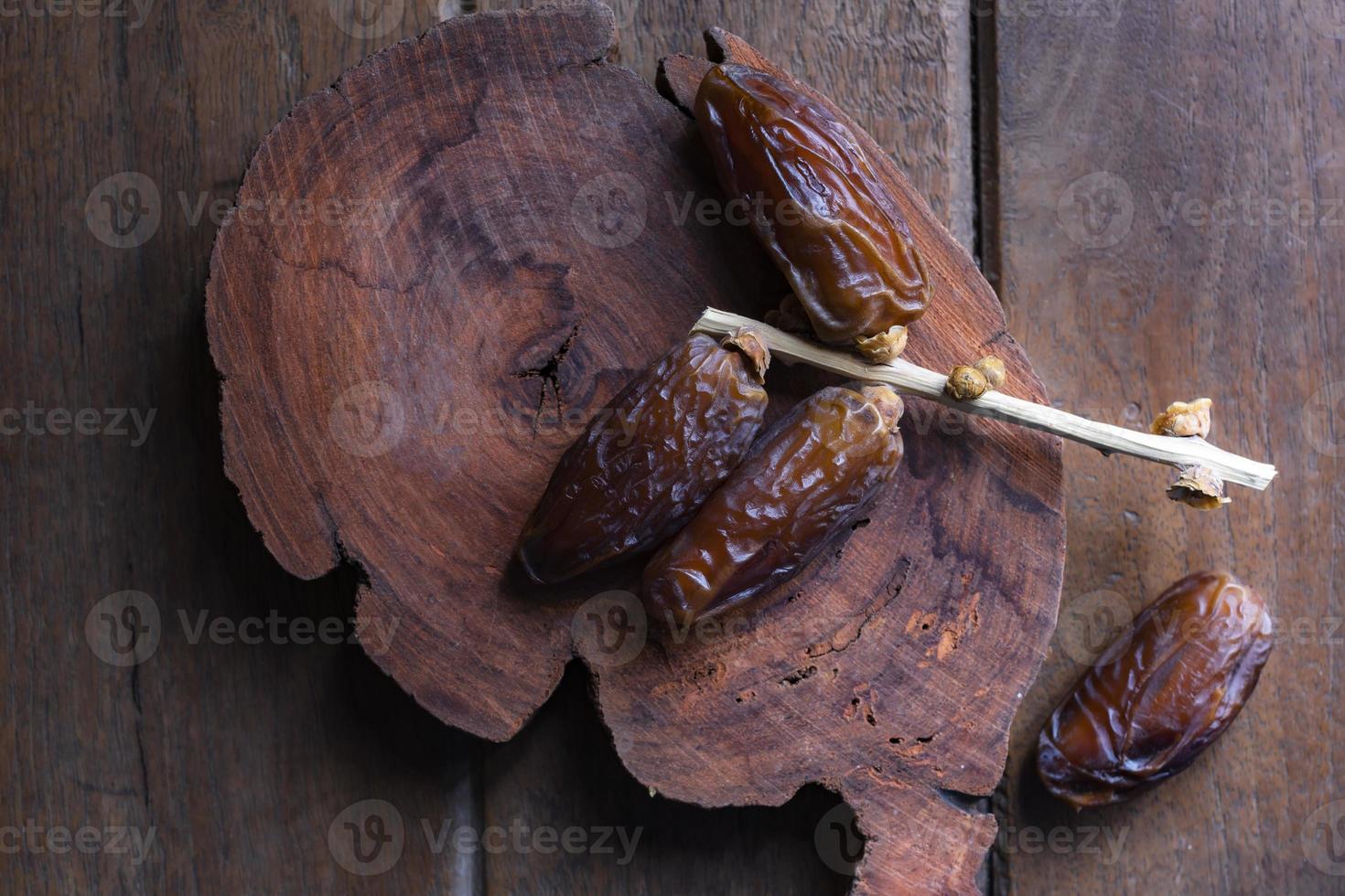 Healthy food date fruit on wood table. photo