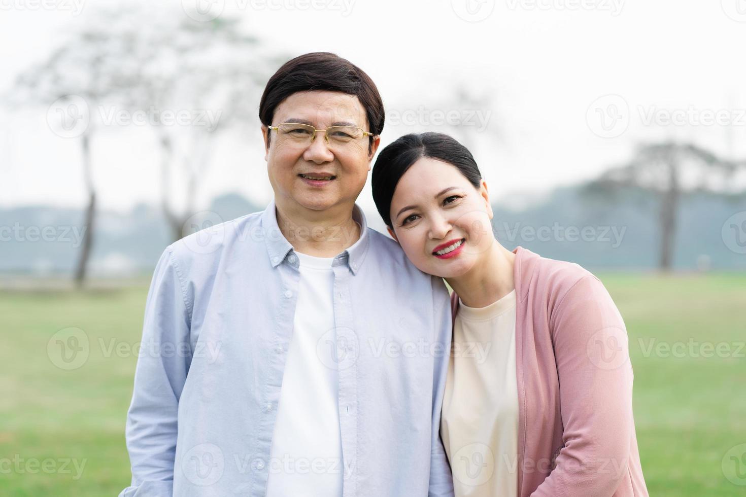 Elderly Asian couple in the park photo