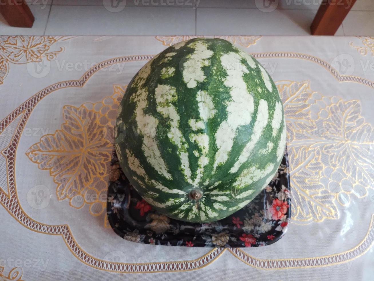 One Watermelon in a Plate on table photo