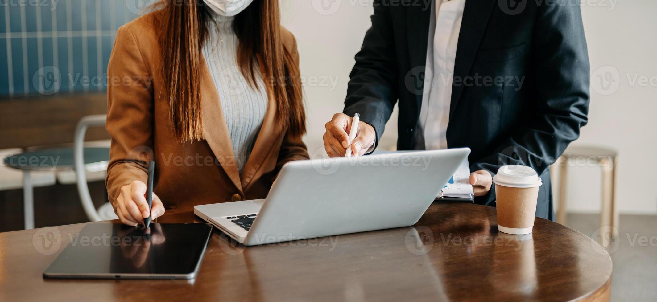 Business team meeting. professional investor working new start up project. Finance task. with smart phone and laptop and digital tablet computer  in morning light photo