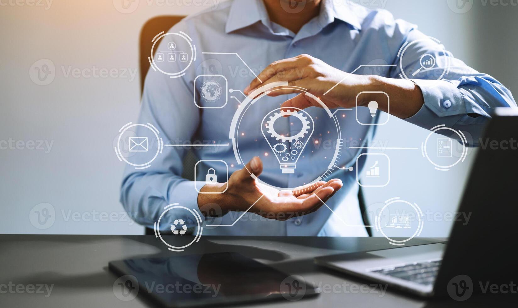 Businessman hand working digital marketing media in virtual screen with mobile phone and modern compute with VR icon diagram at office in morning light photo