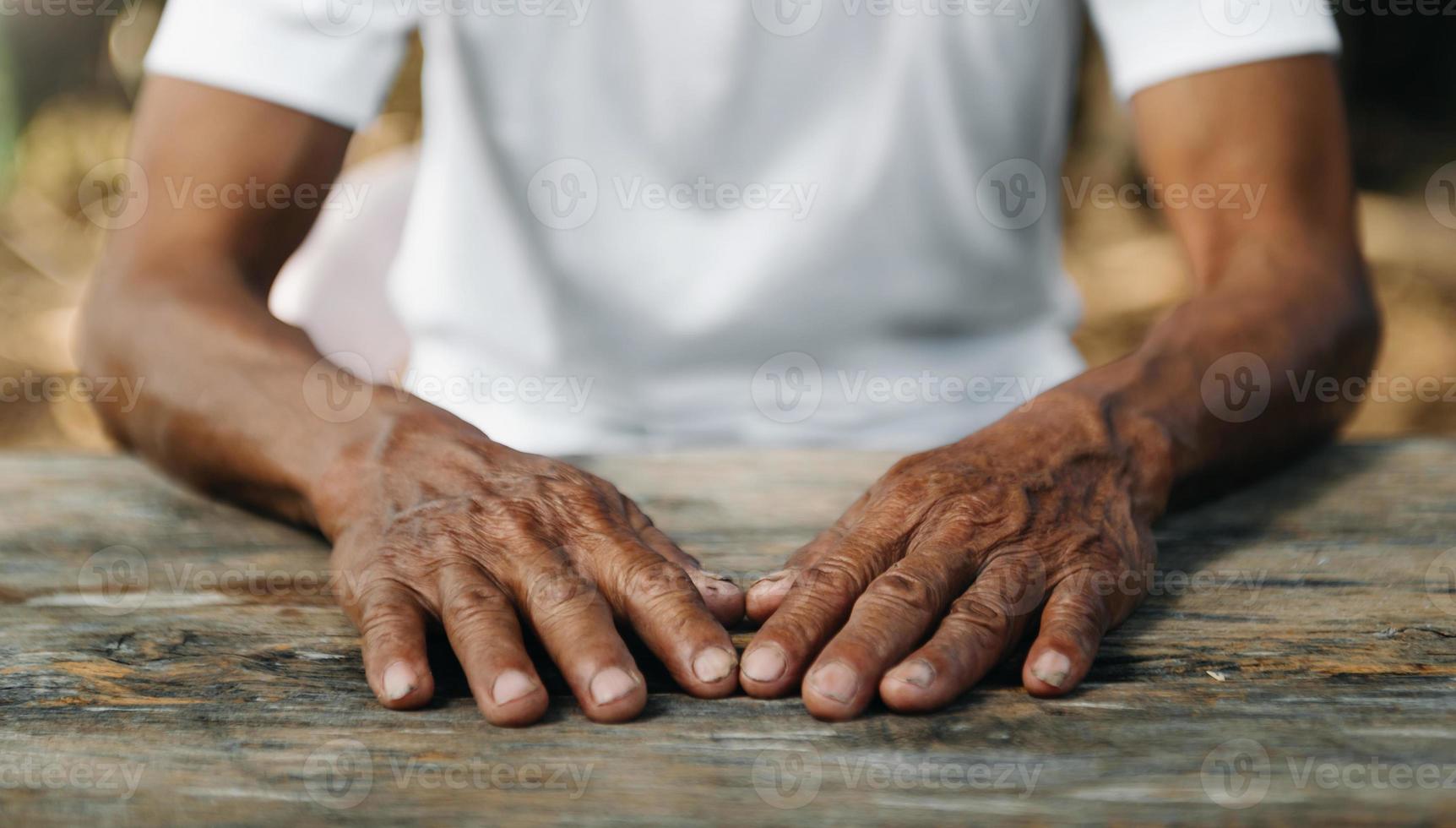 Male wrinkled hands, old man is wearing photo