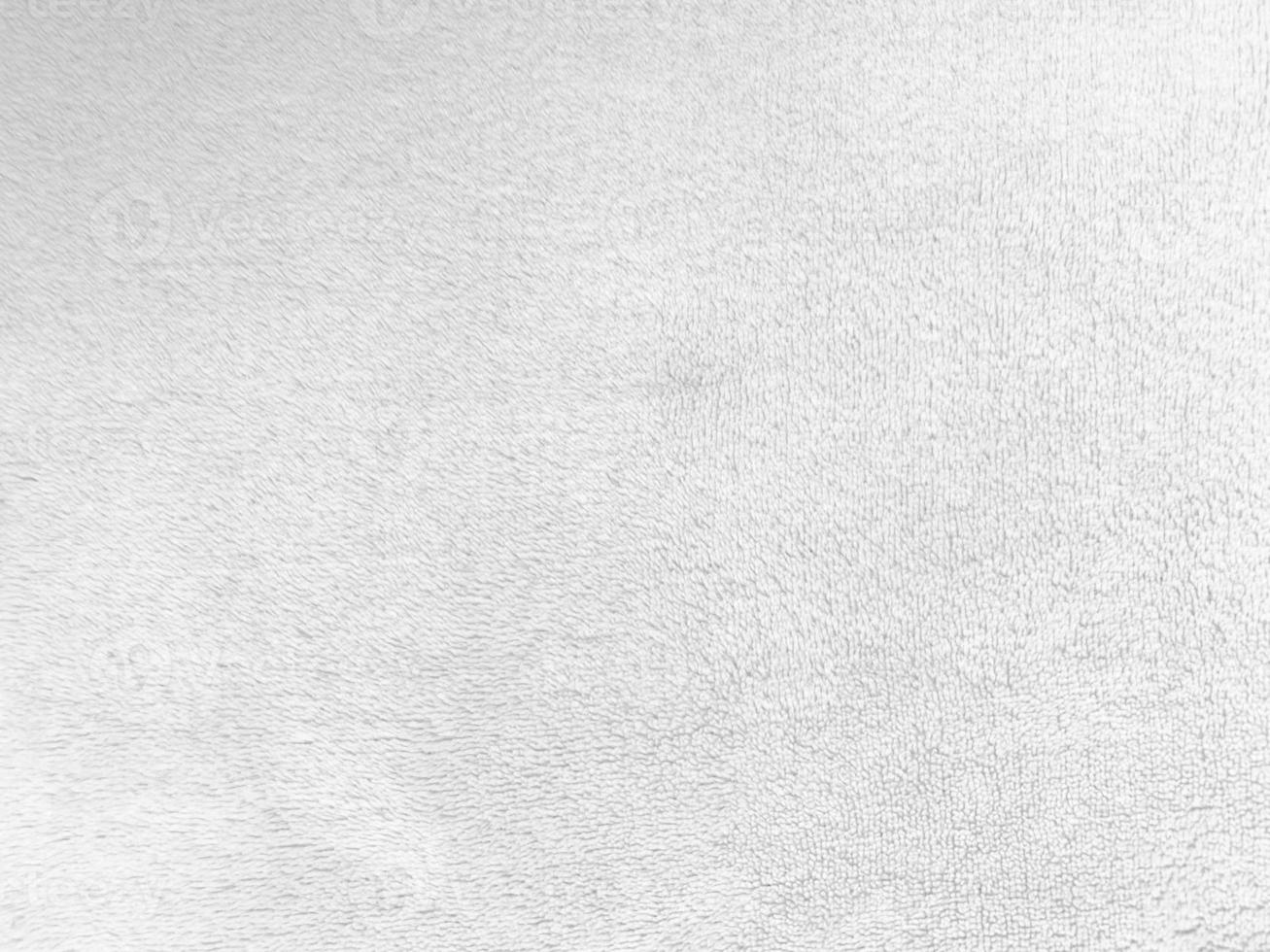 White clean wool texture background. light natural sheep wool. white seamless cotton. texture of fluffy fur for designers. close-up fragment white wool carpet. photo