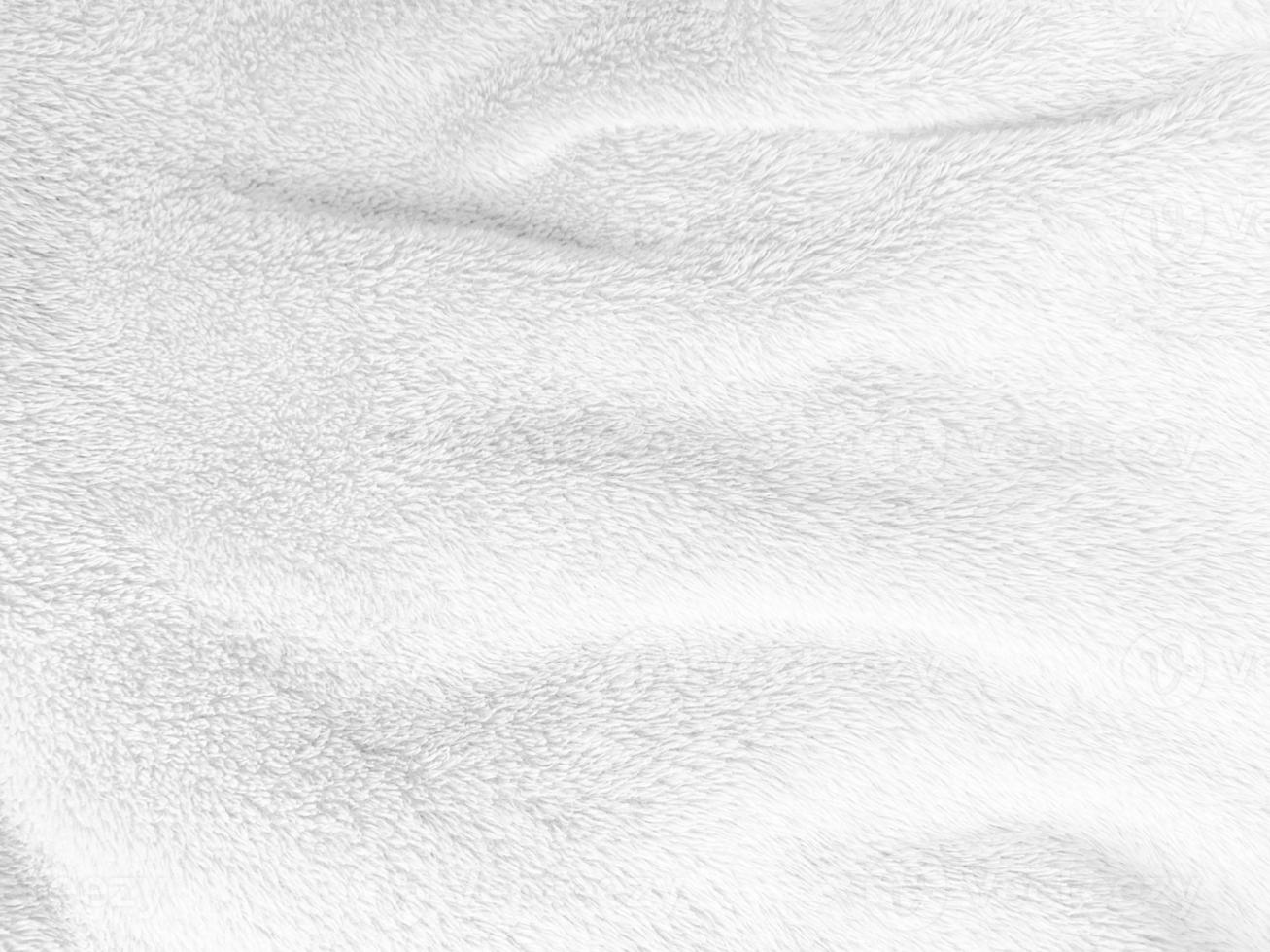 White clean wool texture background. light natural sheep wool. white seamless cotton. texture of fluffy fur for designers. close-up fragment white wool carpet. photo