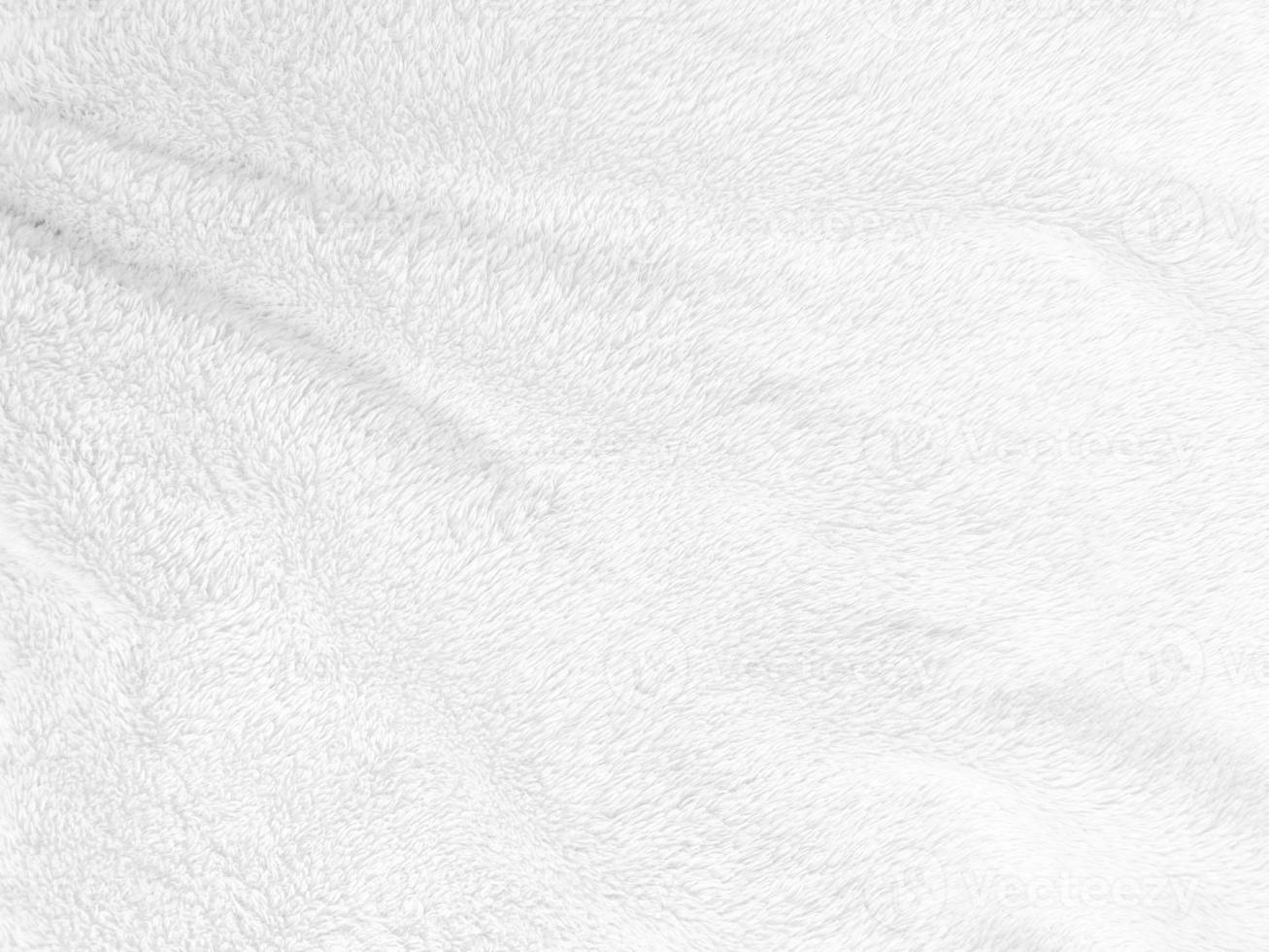 White clean wool texture background. light natural sheep wool. white seamless cotton. texture of fluffy fur for designers. close-up fragment white wool carpet. photo