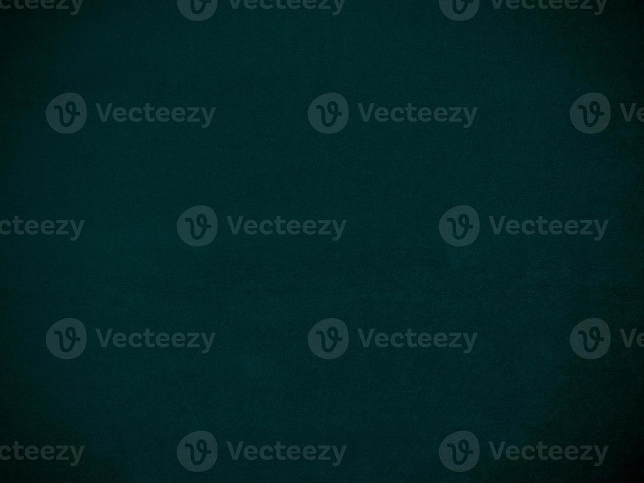Dark green old velvet fabric texture used as background. Empty green fabric background of soft and smooth textile material. There is space for text. photo