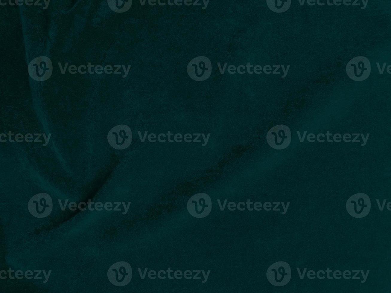 Dark green old velvet fabric texture used as background. Empty green fabric background of soft and smooth textile material. There is space for text. photo