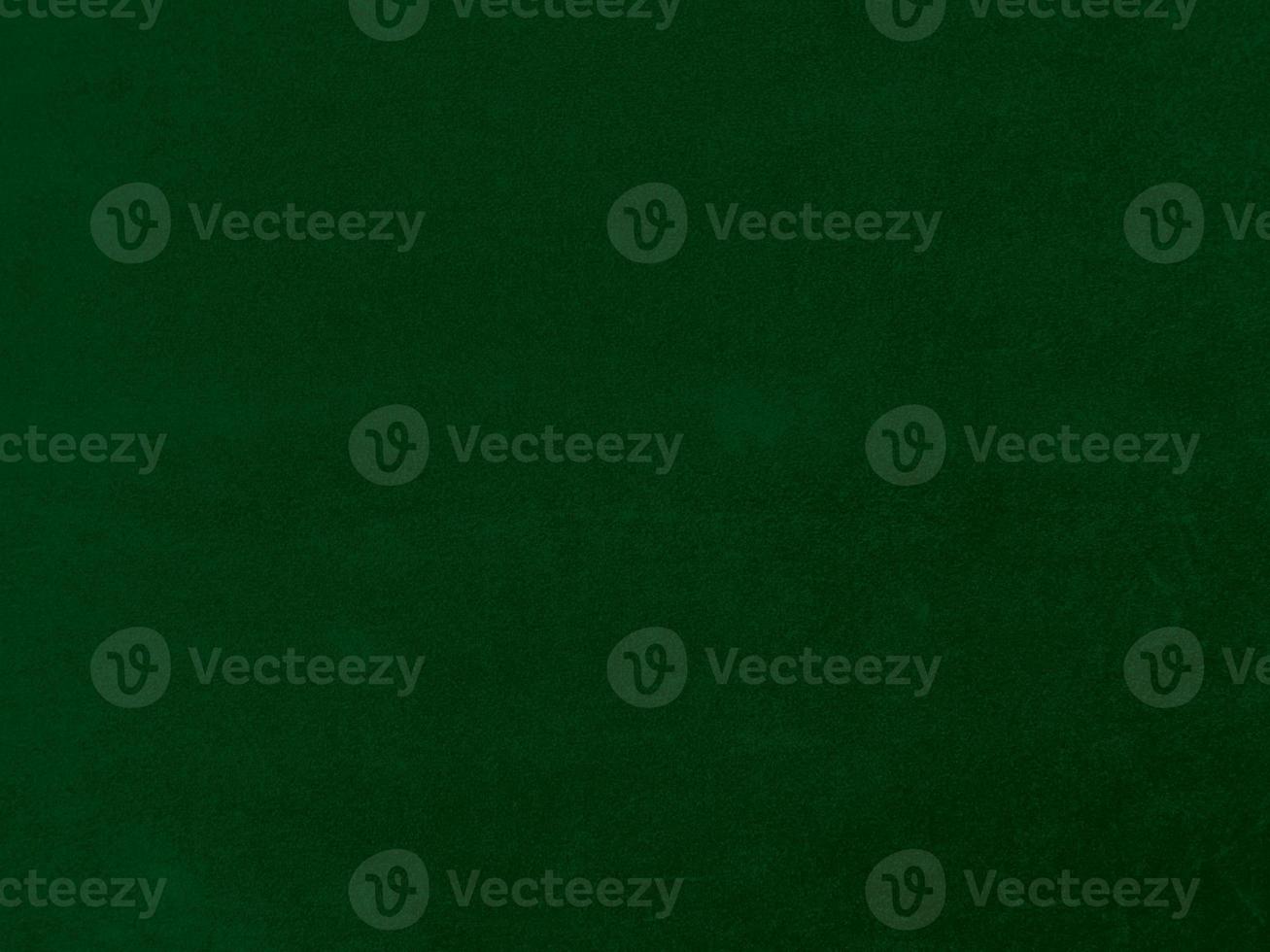 Dark green old velvet fabric texture used as background. Empty green fabric background of soft and smooth textile material. There is space for text. photo