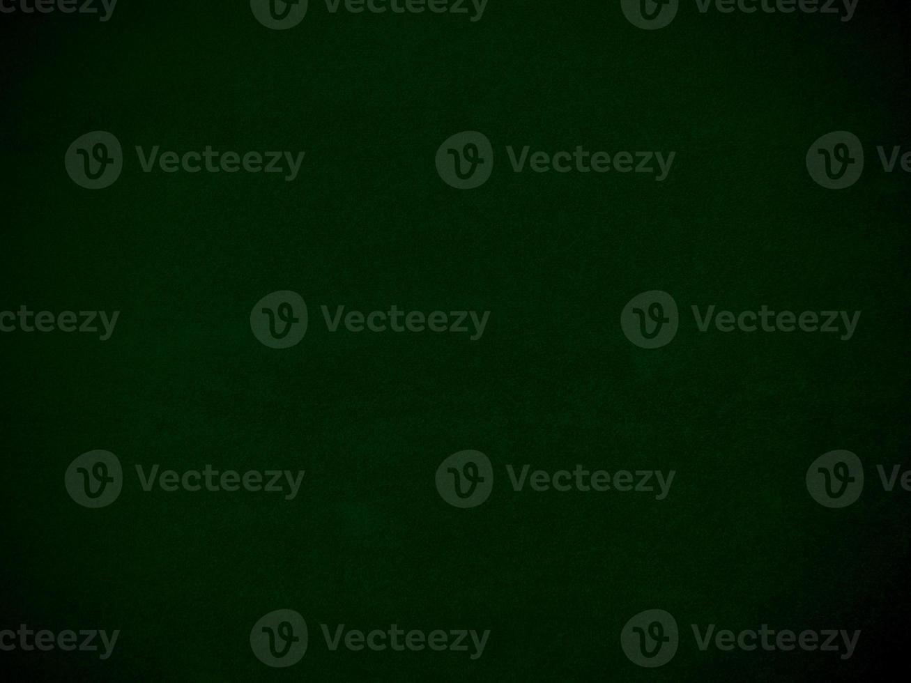 Dark green old velvet fabric texture used as background. Empty green fabric background of soft and smooth textile material. There is space for text. photo