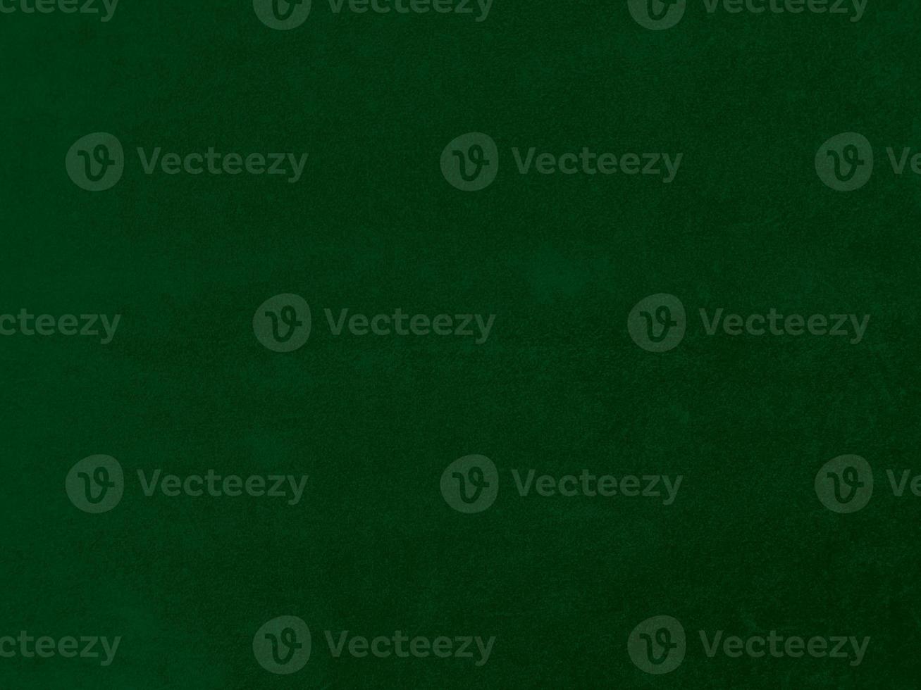 Dark green old velvet fabric texture used as background. Empty green fabric background of soft and smooth textile material. There is space for text. photo