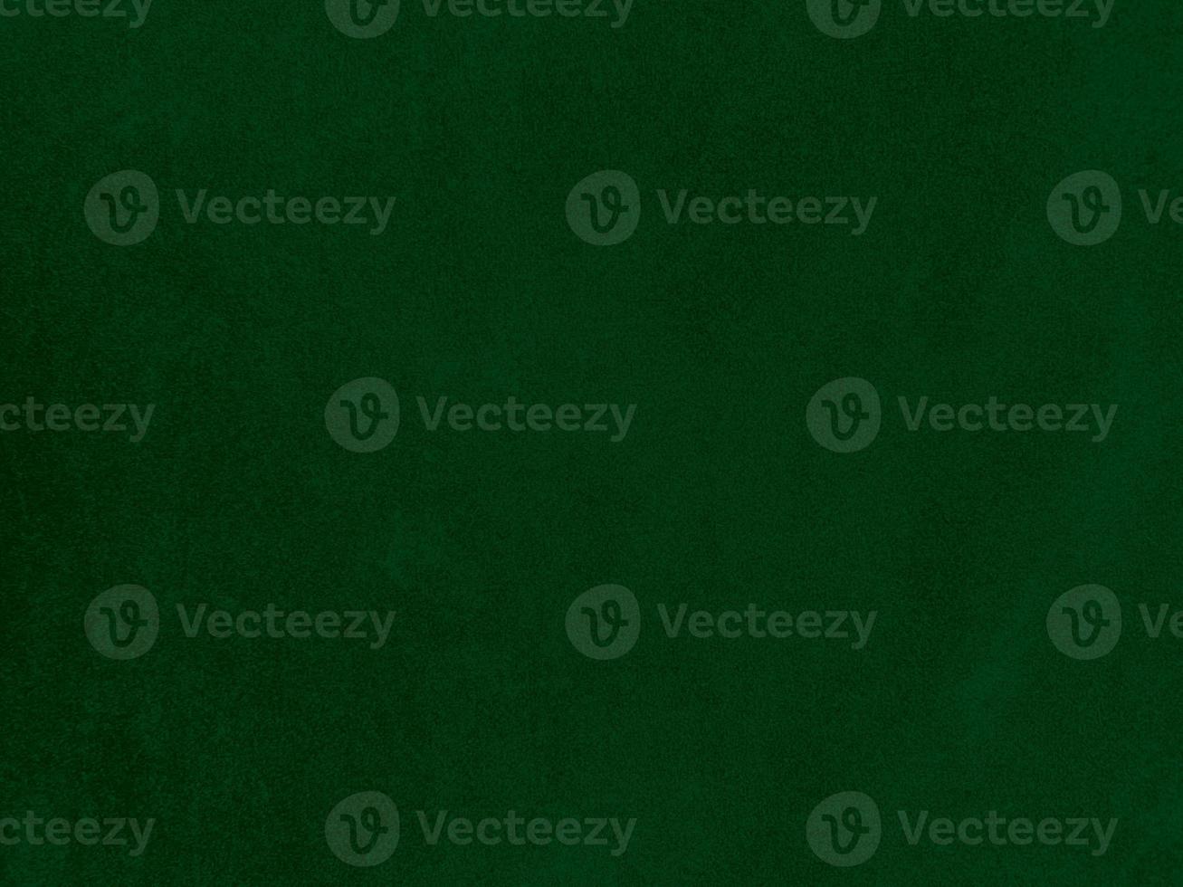 Dark green old velvet fabric texture used as background. Empty green fabric background of soft and smooth textile material. There is space for text. photo