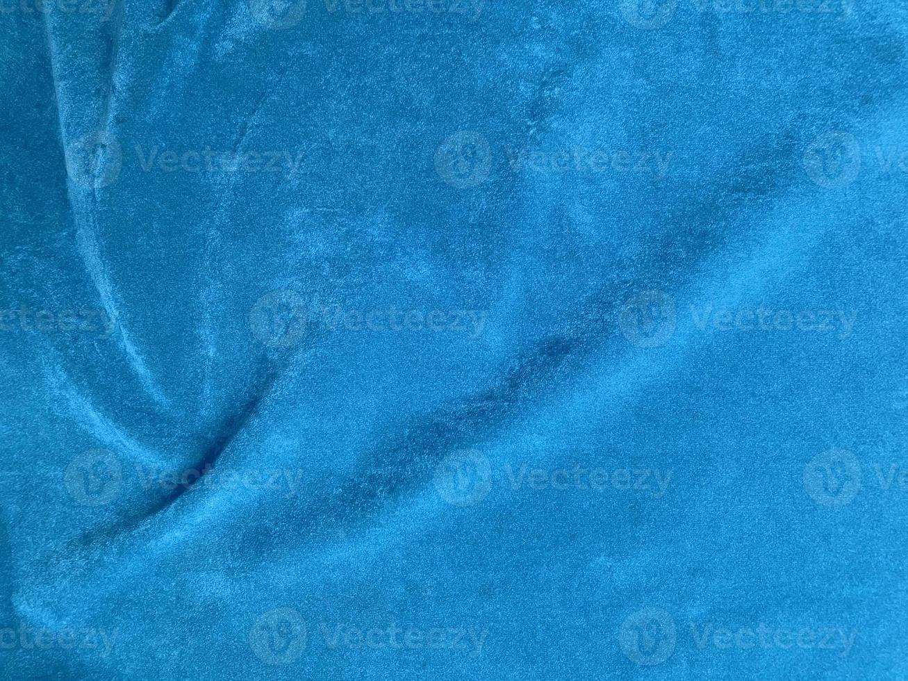 Light blue velvet fabric texture used as background. Empty light blue fabric background of soft and smooth textile material. There is space for text. photo