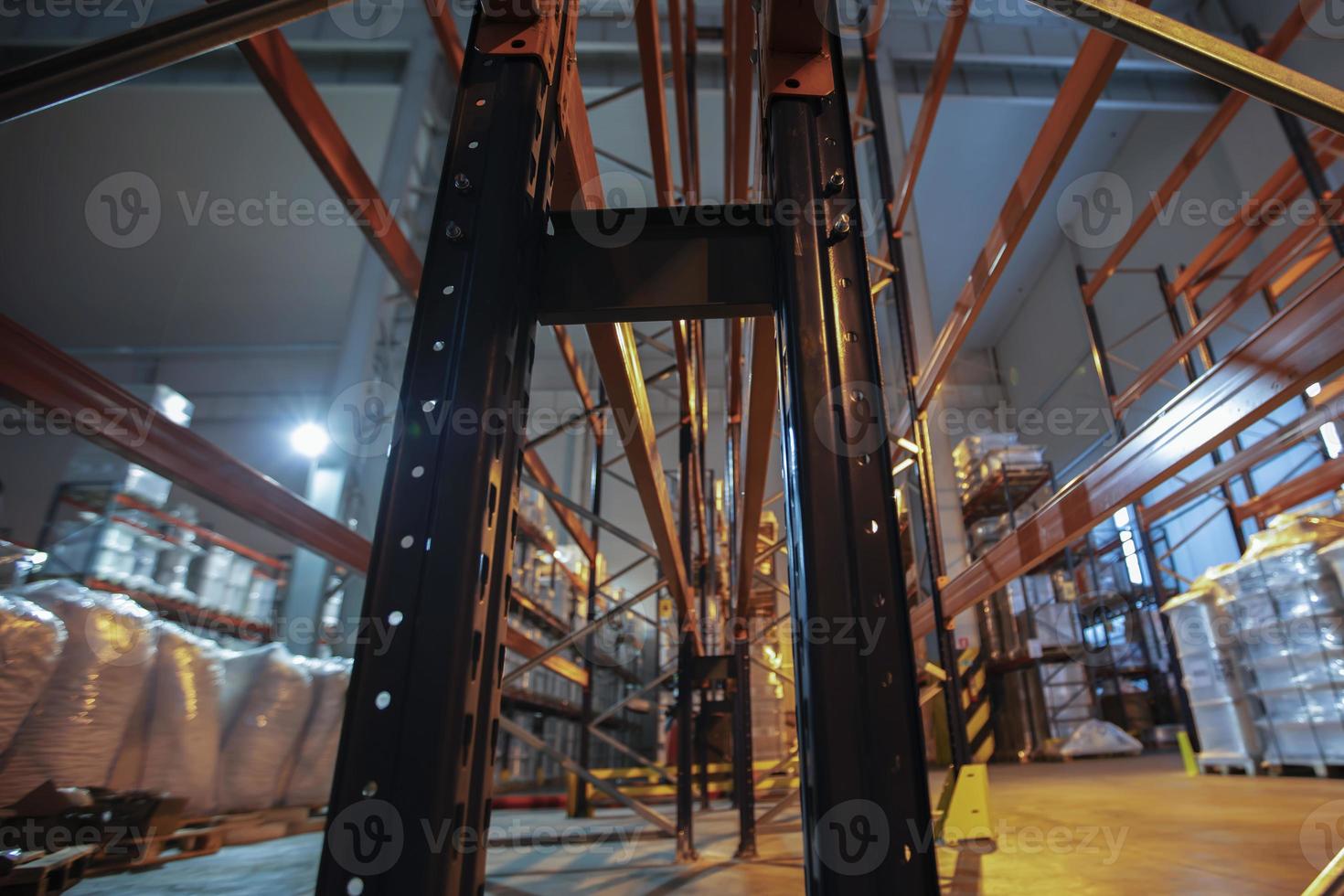 Warehouse premises of a factory or workshop with metal shelves. photo