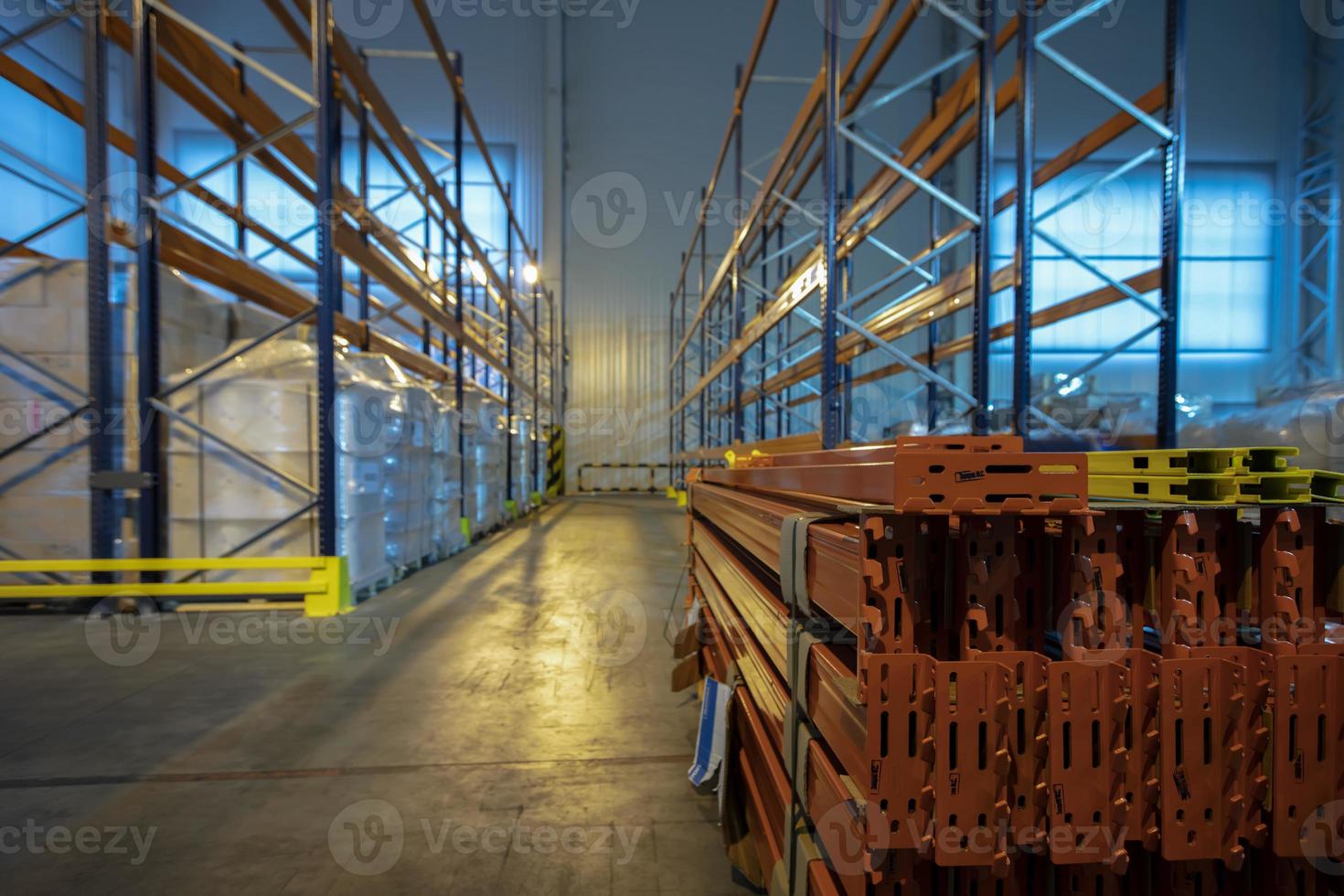 Warehouse premises of a factory or workshop with metal shelves. photo