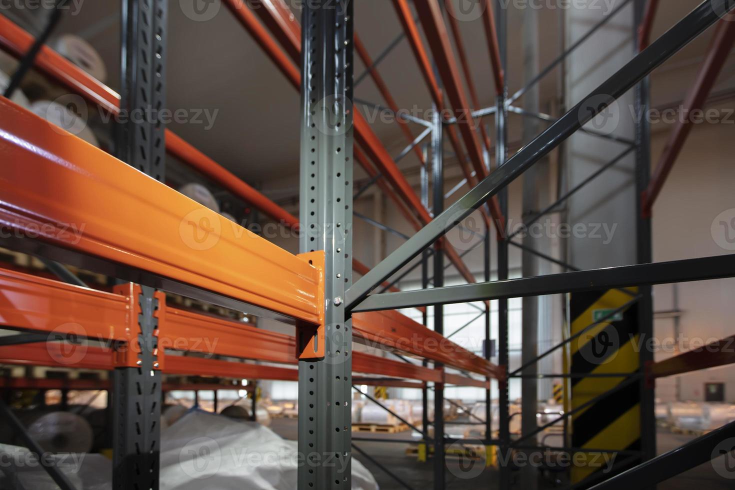 Warehouse premises of a factory or workshop with metal shelves. photo